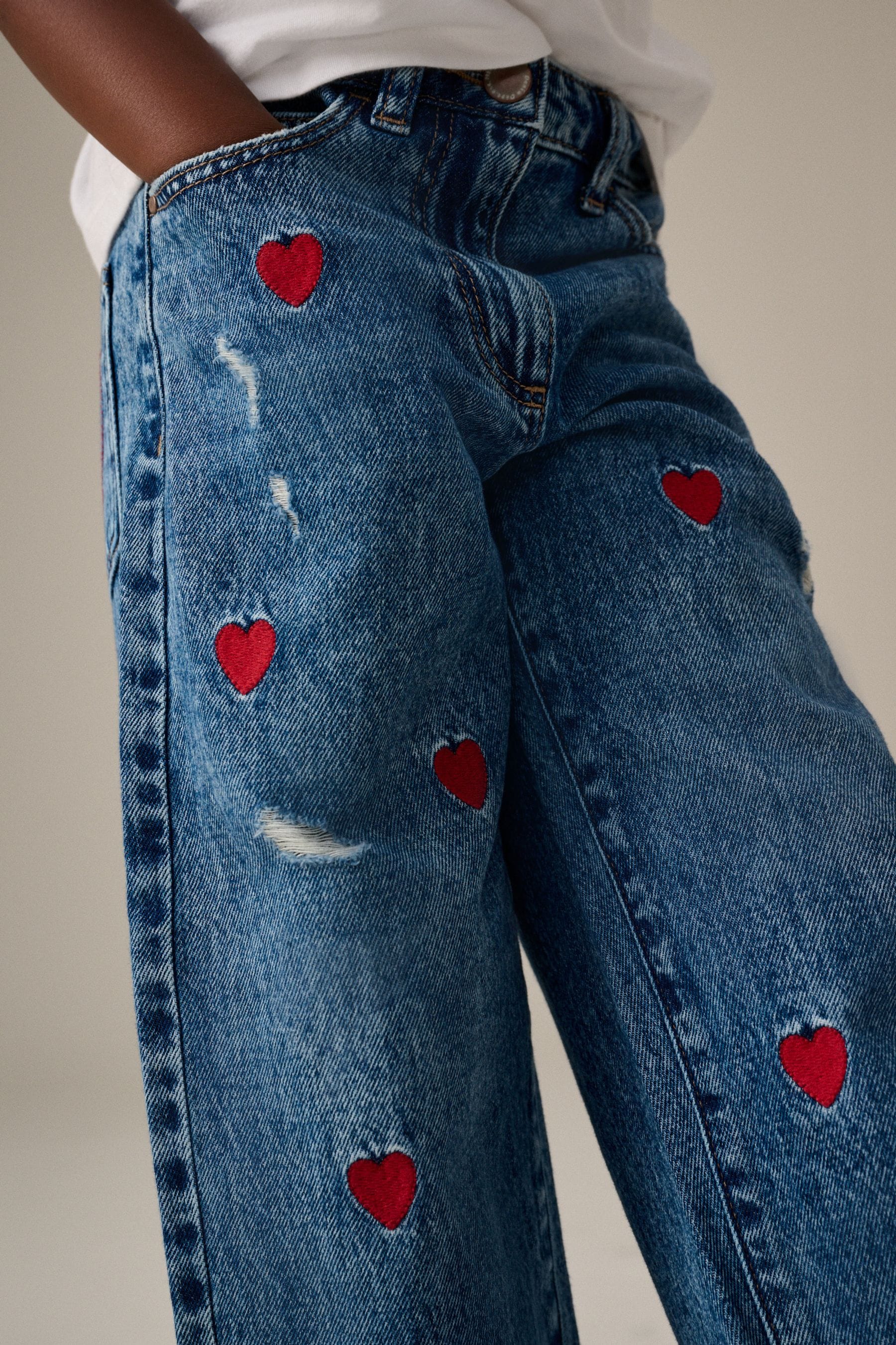 Heart embroidered jeans deals