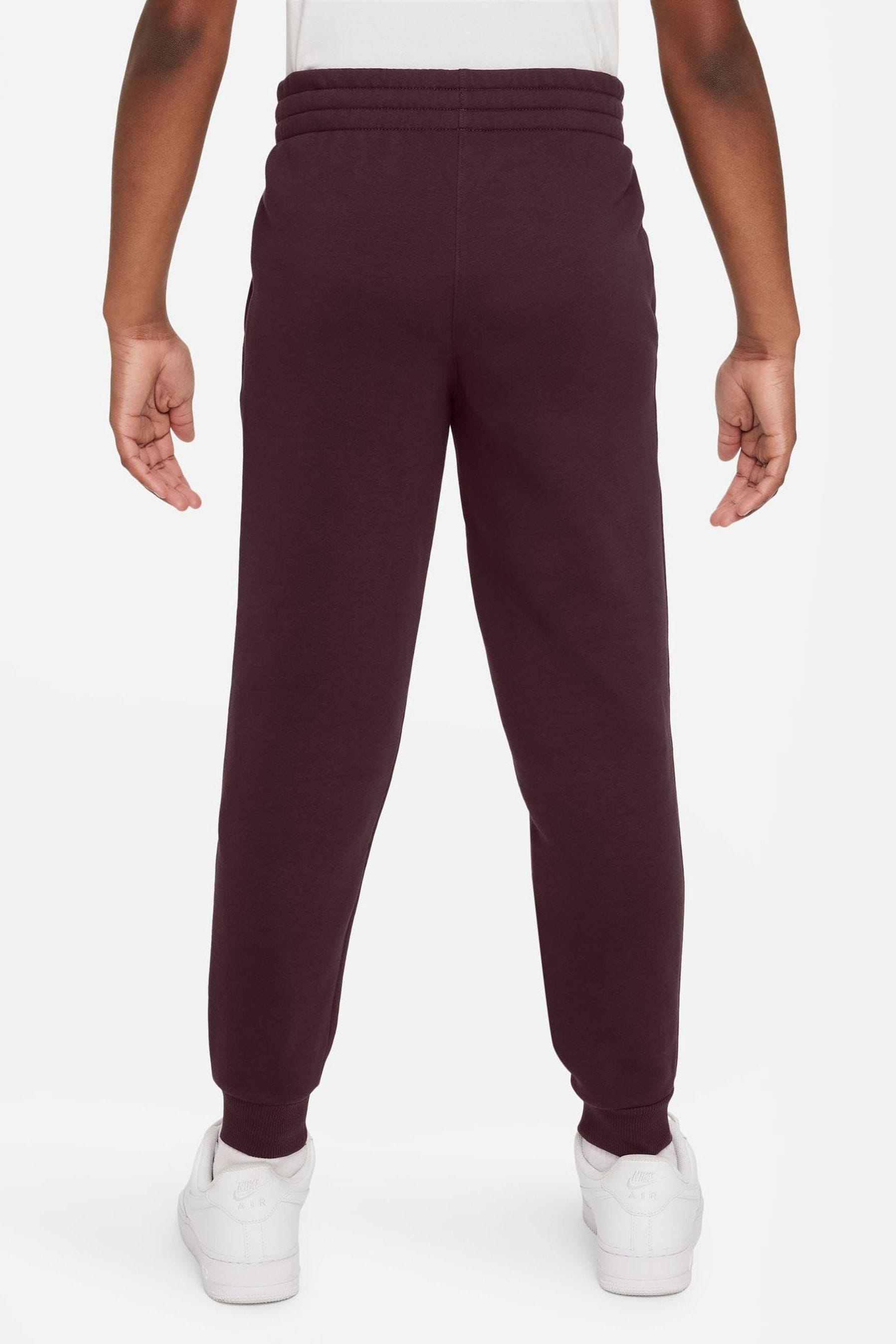 Buy Nike Burgundy Red Club Fleece Joggers from Next Luxembourg