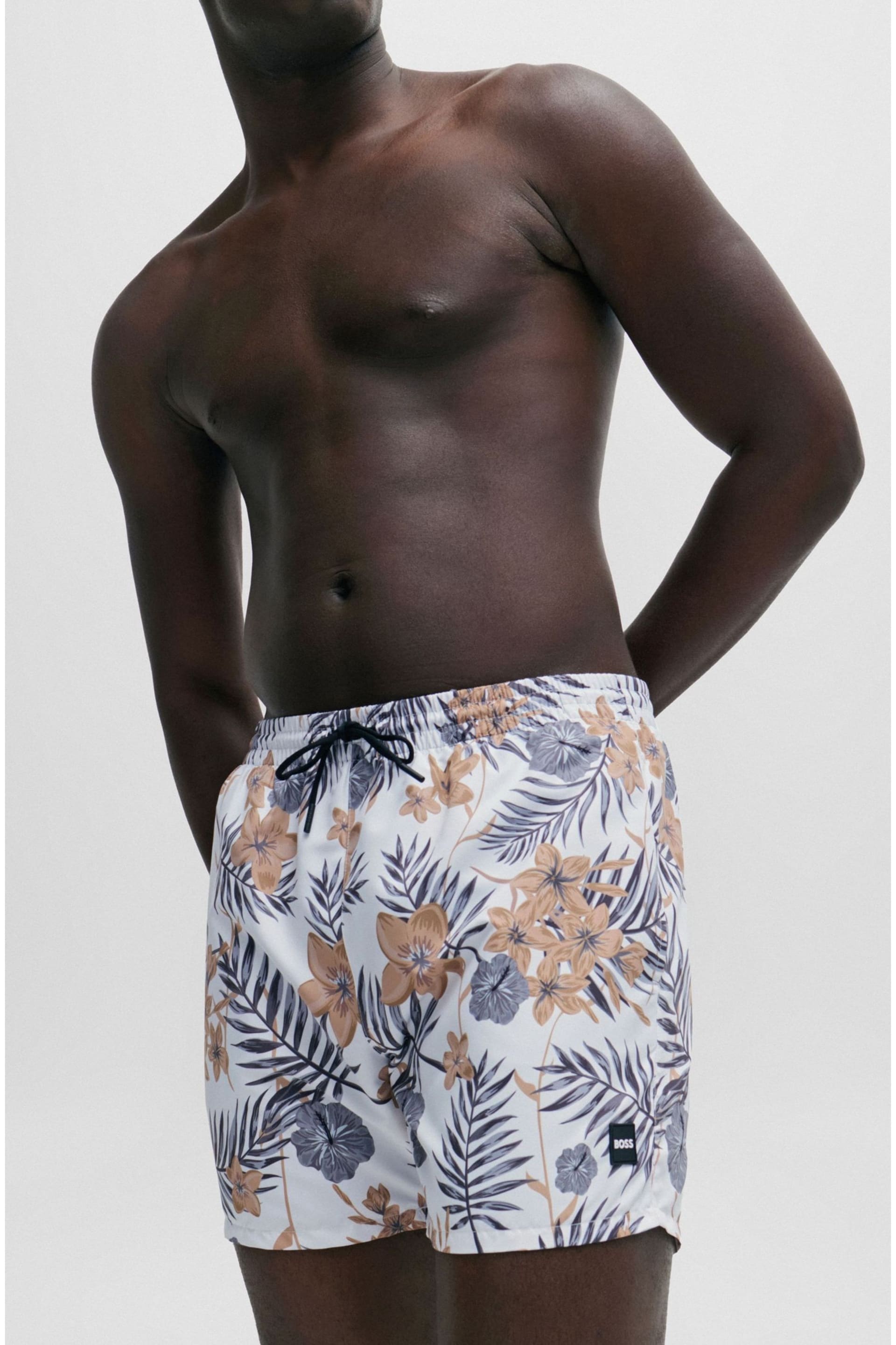 BOSS White Tropical-Print Quick-Drying Swim Shorts With Logo Badge - Image 1 of 4