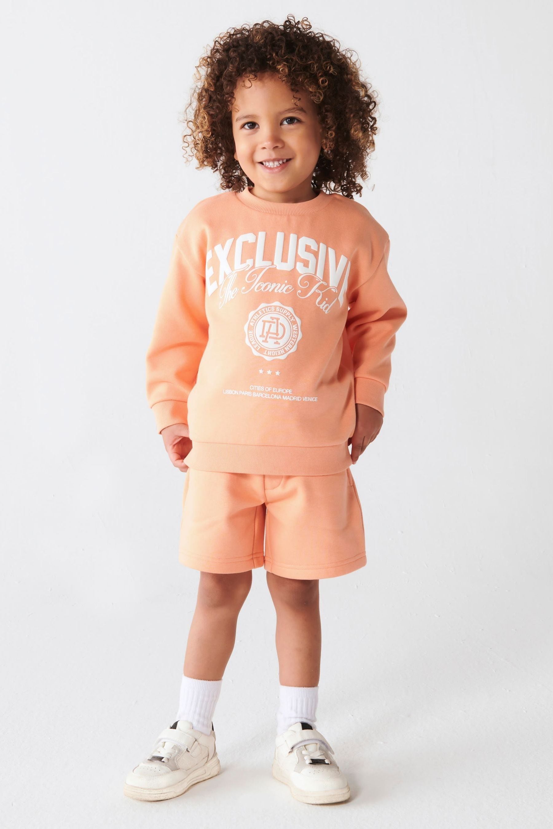 Buy River Island Coral Mini Boys Varsity Sweat Short Set from Next Luxembourg