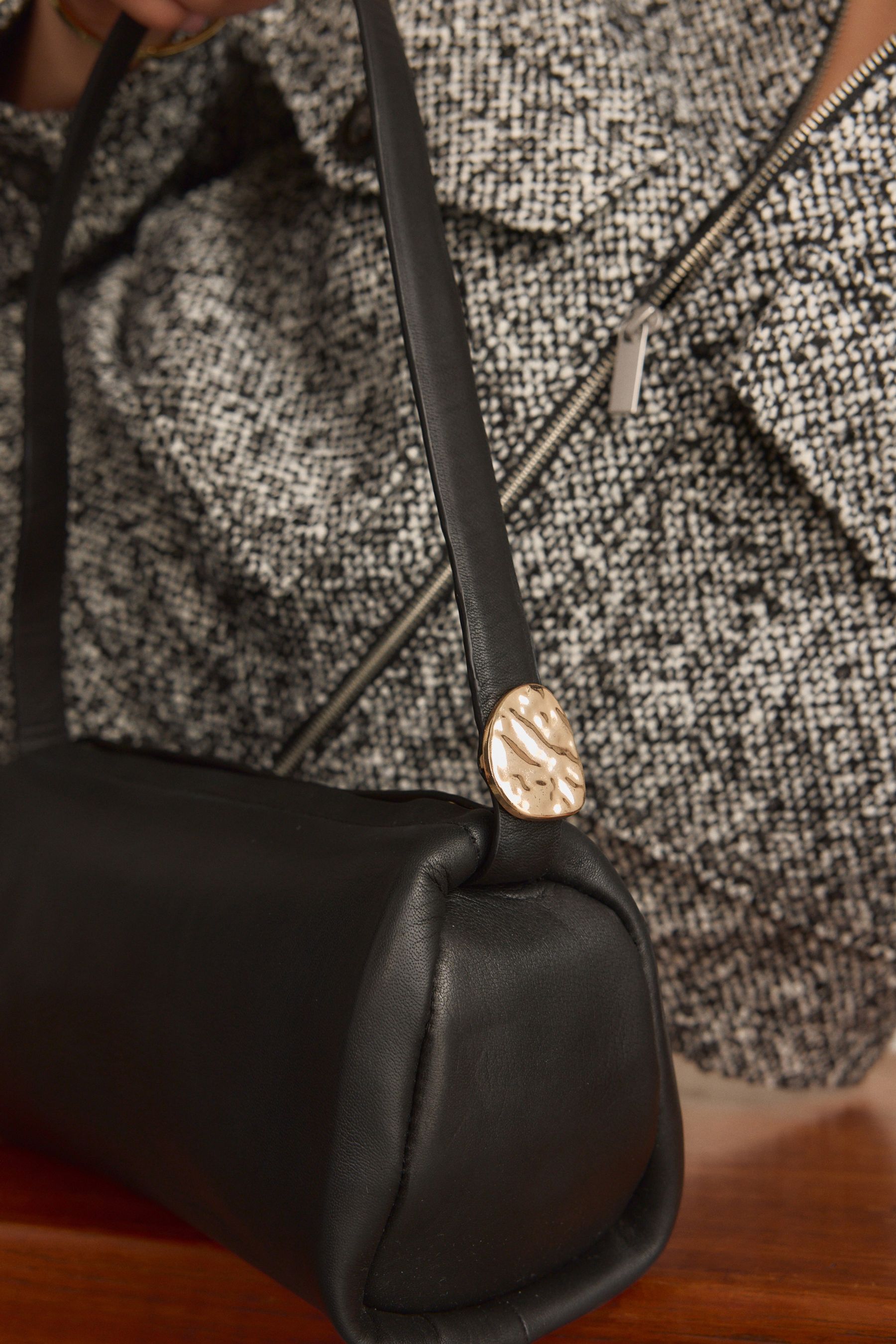Black leather barrel bag top