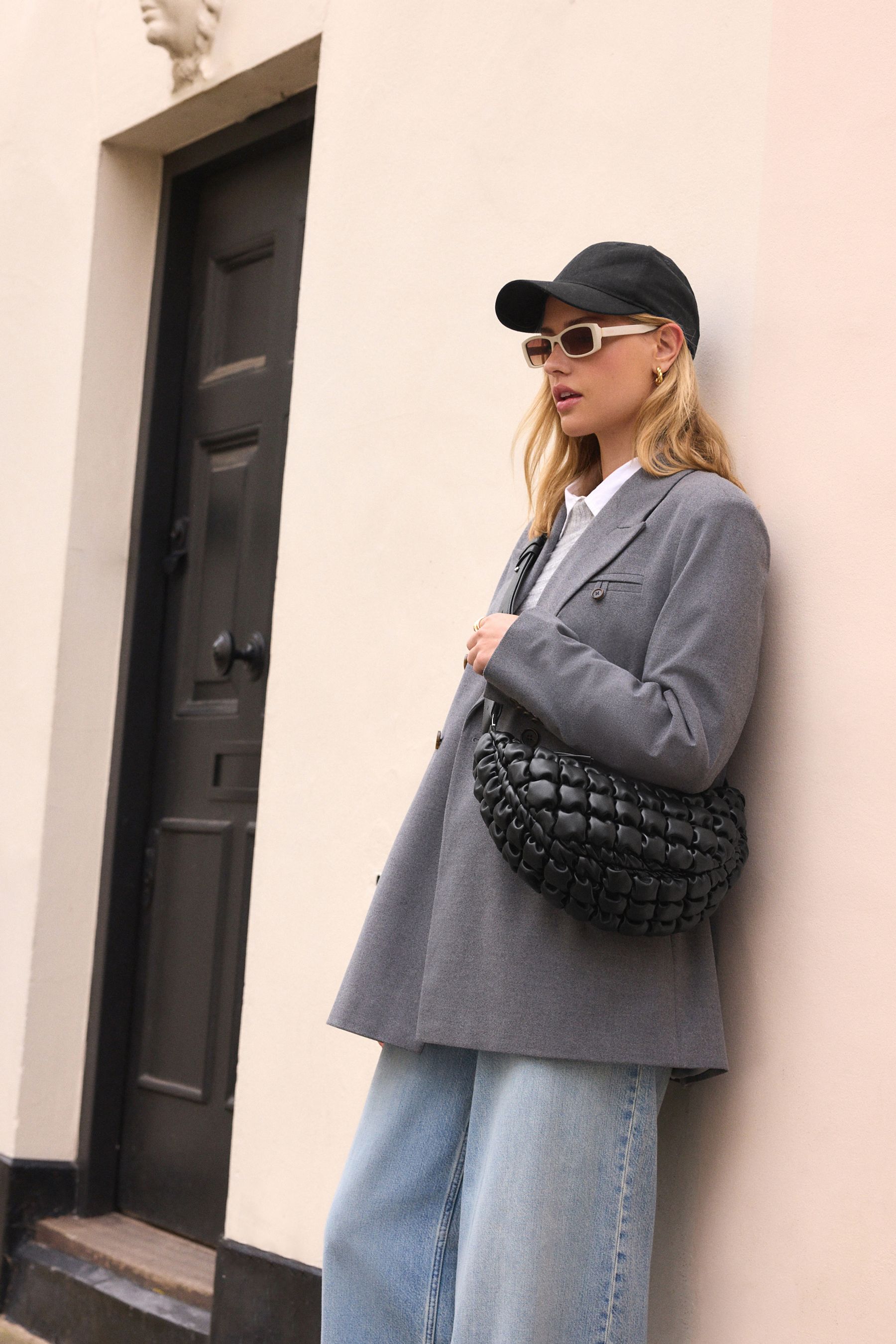 Black quilted sling bag sale
