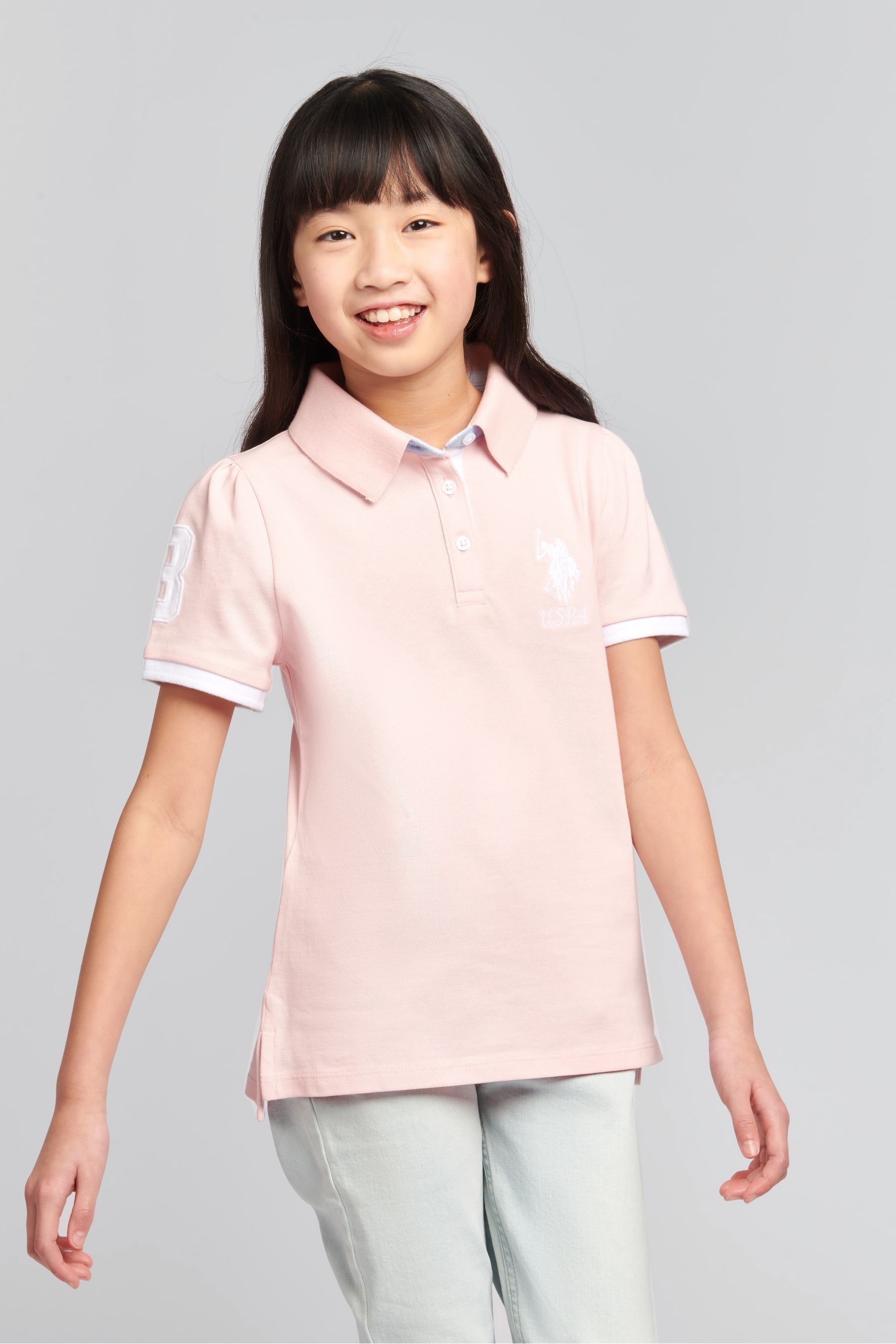 Girls pink polo sales