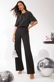 Friends Like These Black Sparkly Chiffon Short Flutter Sleeve Jumpsuit - Image 1 of 4