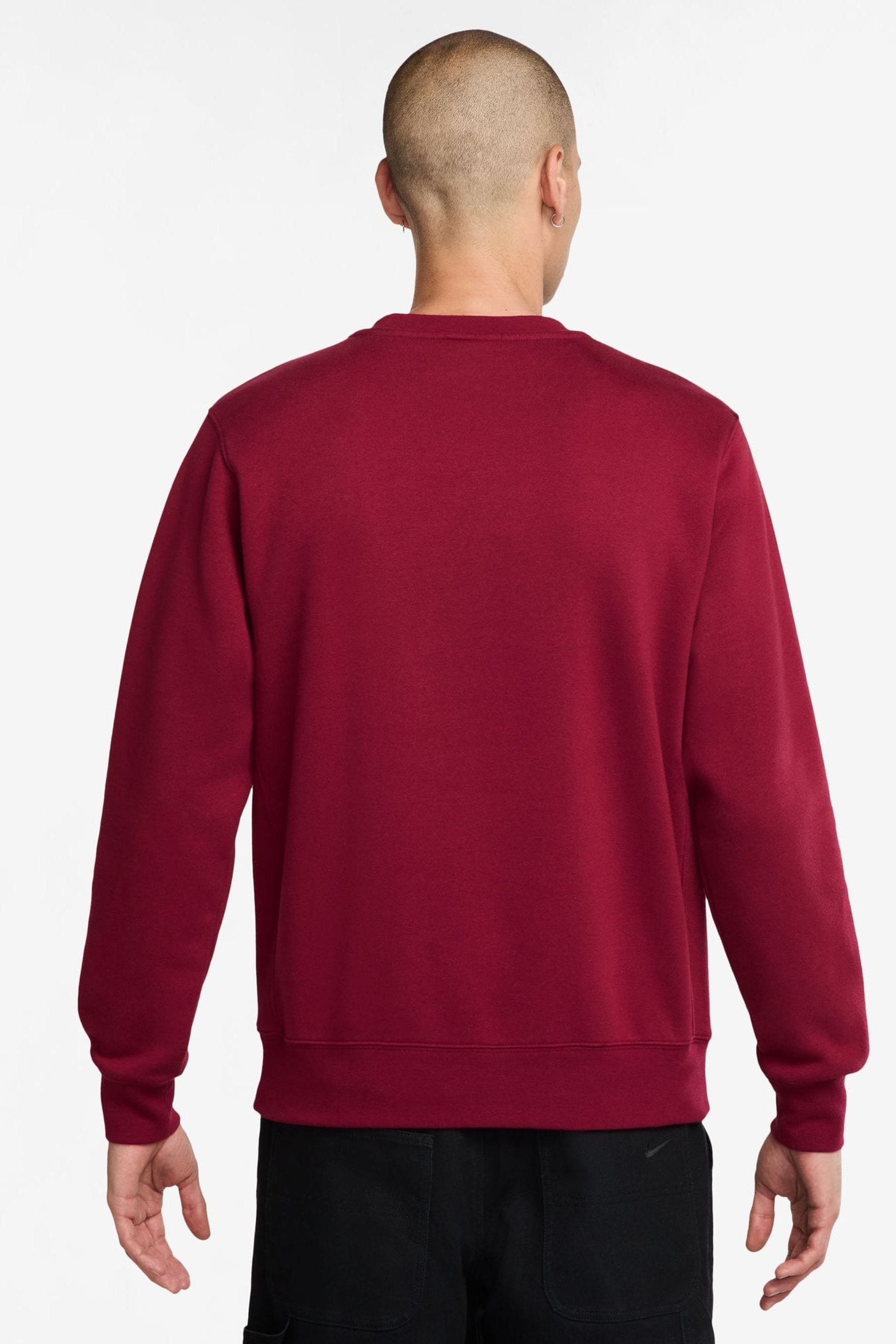 Red and white nike sweatshirt top