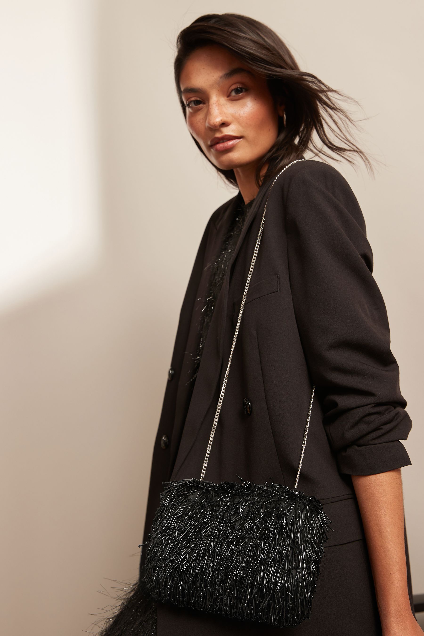 Black tassel clutch bag hot sale
