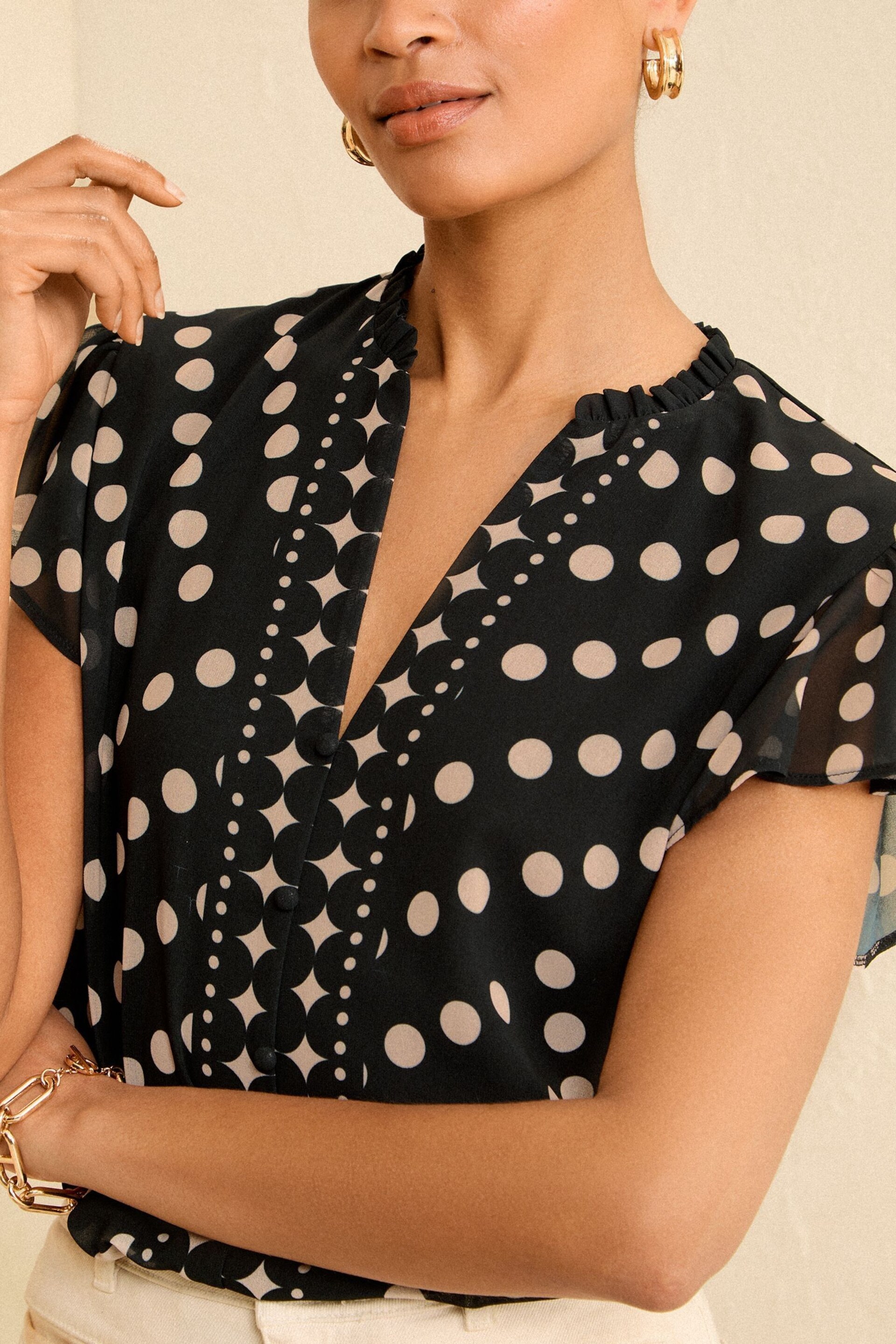 Love & Roses Black Polka Dot V Neck Flutter Sleeve Blouse - Image 2 of 4