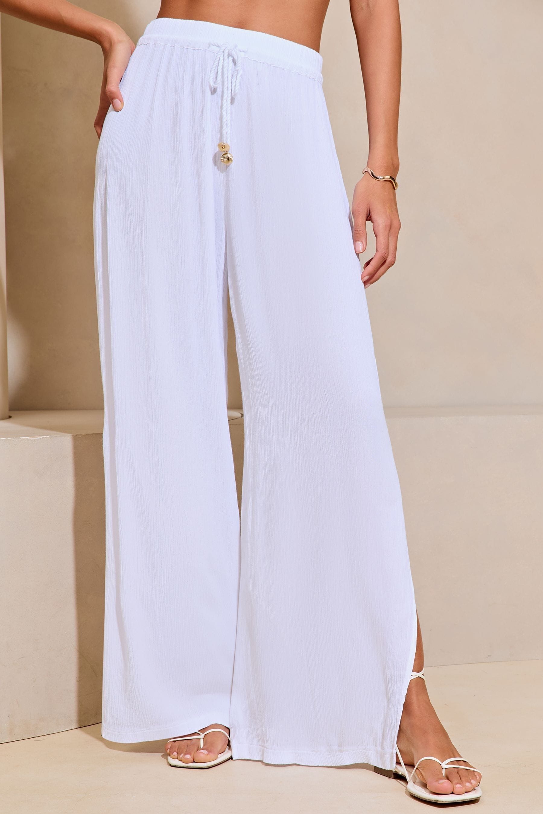 Buy Lipsy White Crinkle Holiday Cover Up Trousers from Next Luxembourg