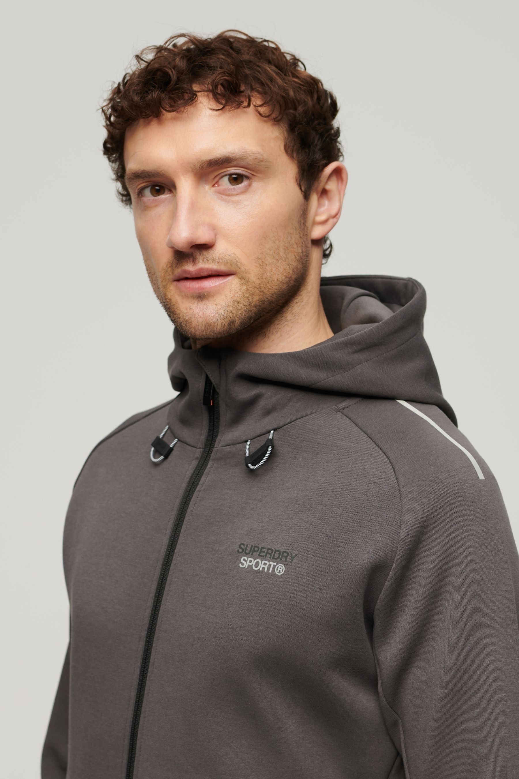 Buy Superdry Grey Sport Tech Logo Loose Zip Hoodie from Next Oman