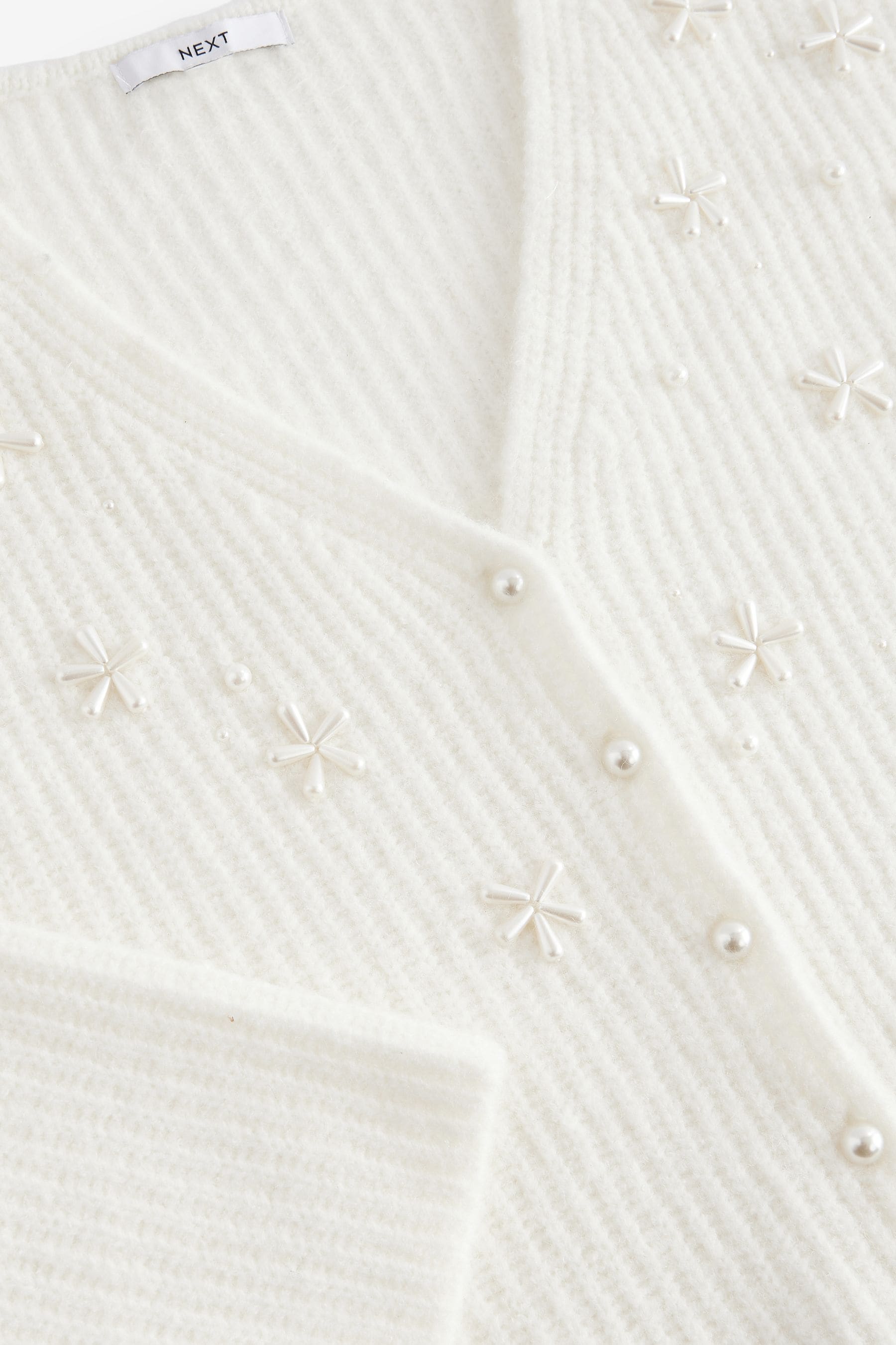 White embellished cardigan top
