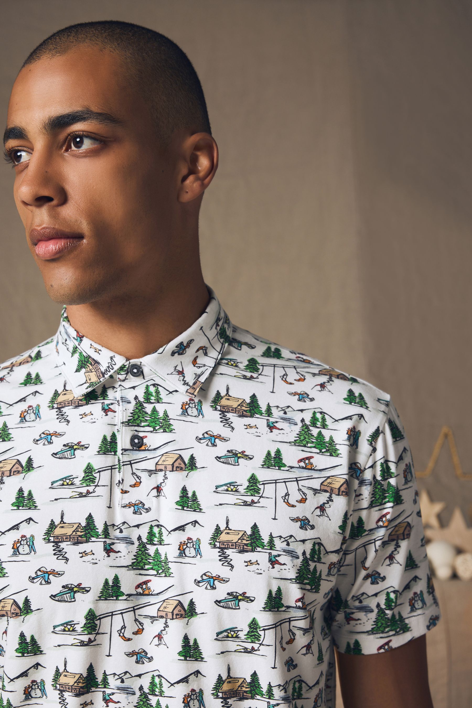 Buy White Ski Christmas Print Polo Shirt from the Next UK online shop