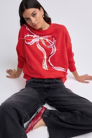 Bright Red/Silver Christmas Sparkle Sequin Front Bow Graphic Crew Neck Sweatshirt - Image 1 of 8