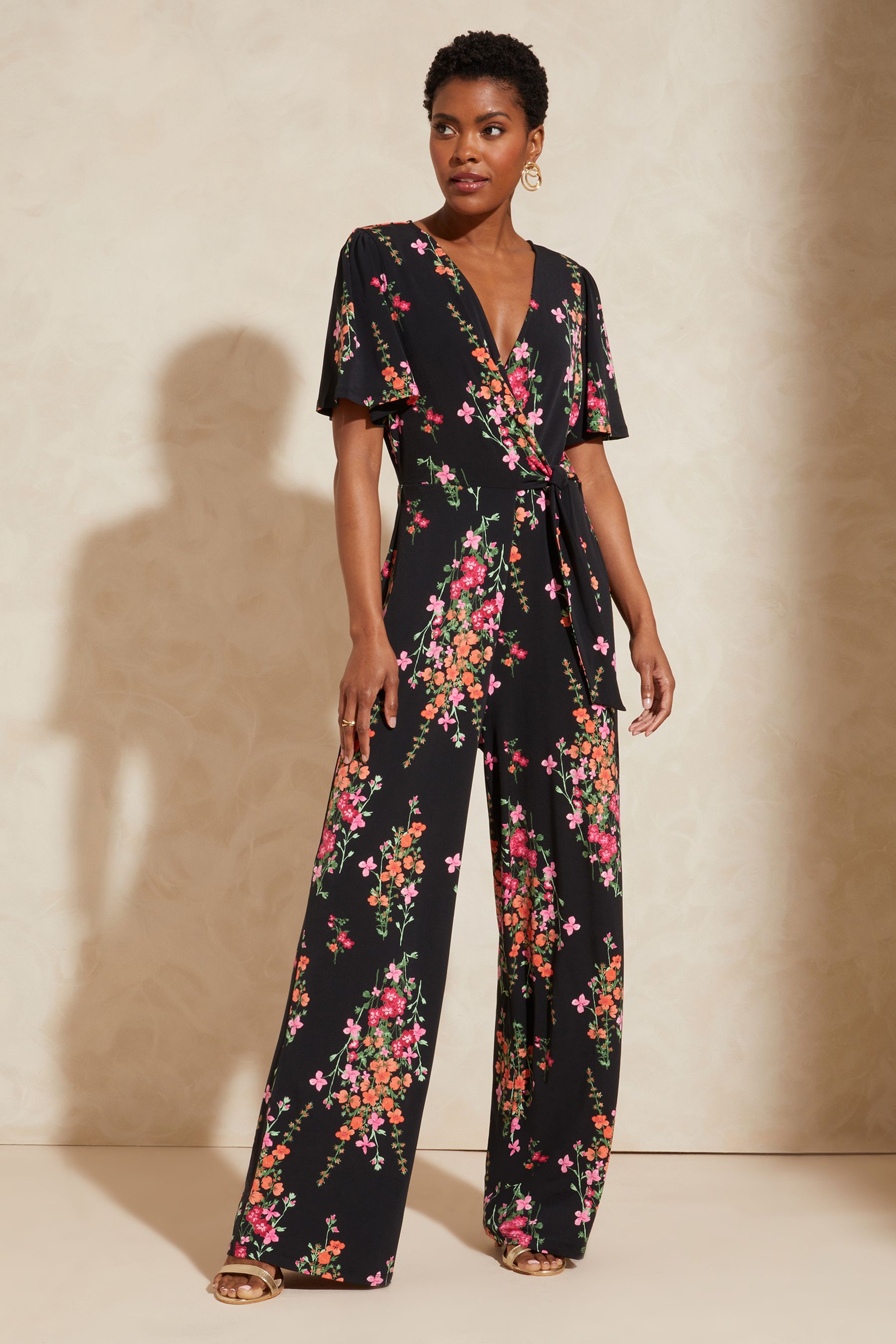 Floral black jumpsuit on sale