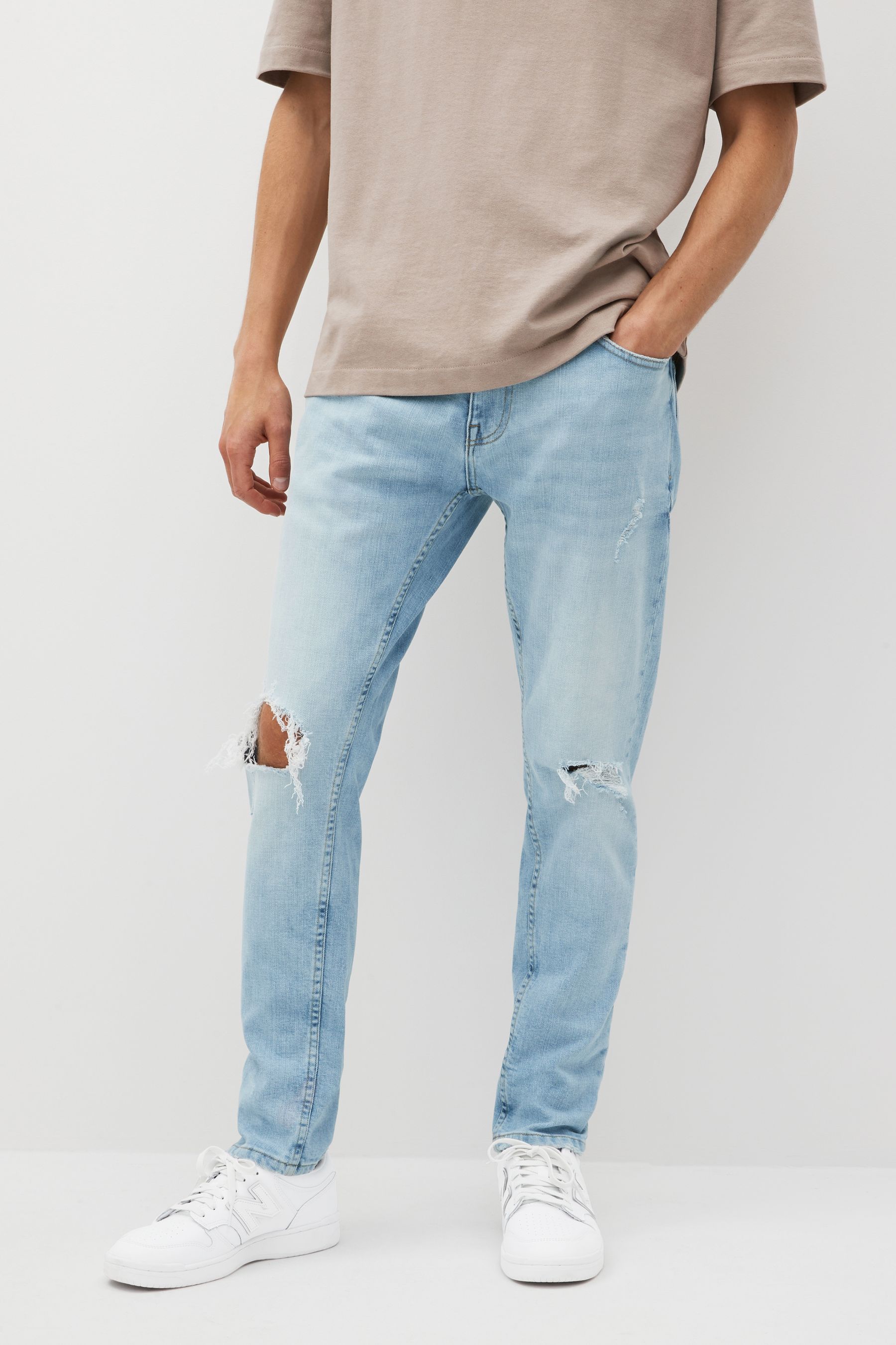 Light blue skinny ripped jeans 2025