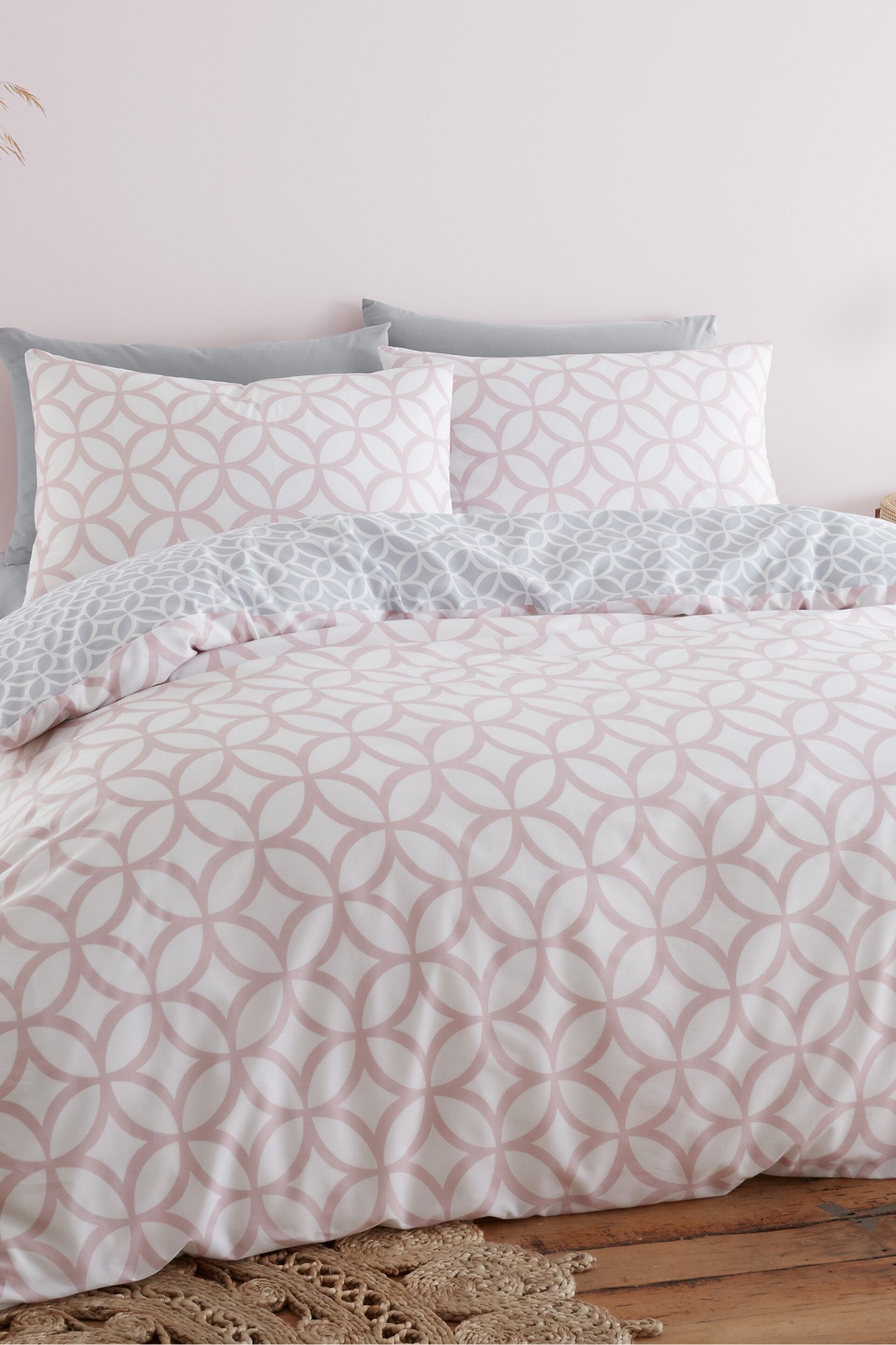 Catherine Lansfield Pink Geo Trellis Reversible Duvet Cover and Pillowcase Set - Image 1 of 4
