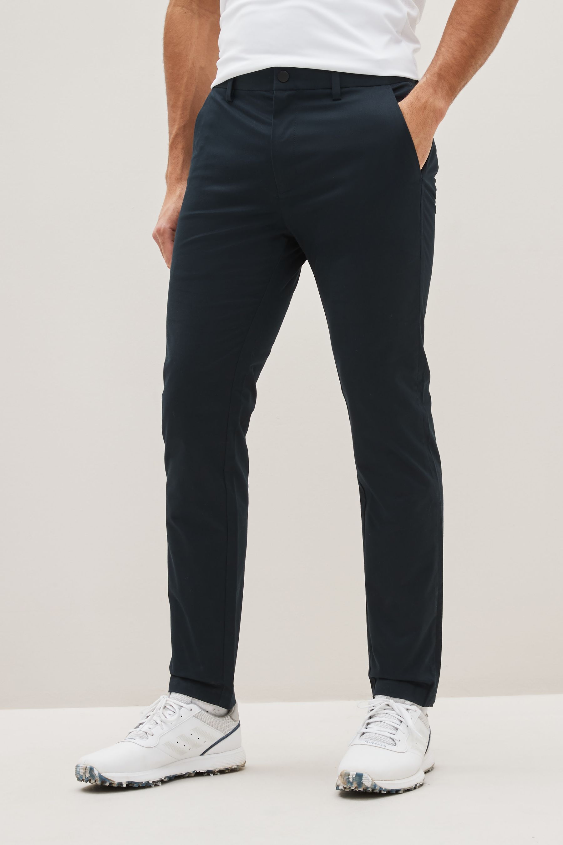 Buy Navy Blue Slim Fit Shower Resistant Golf Stretch Chino Trousers from the Next UK online shop