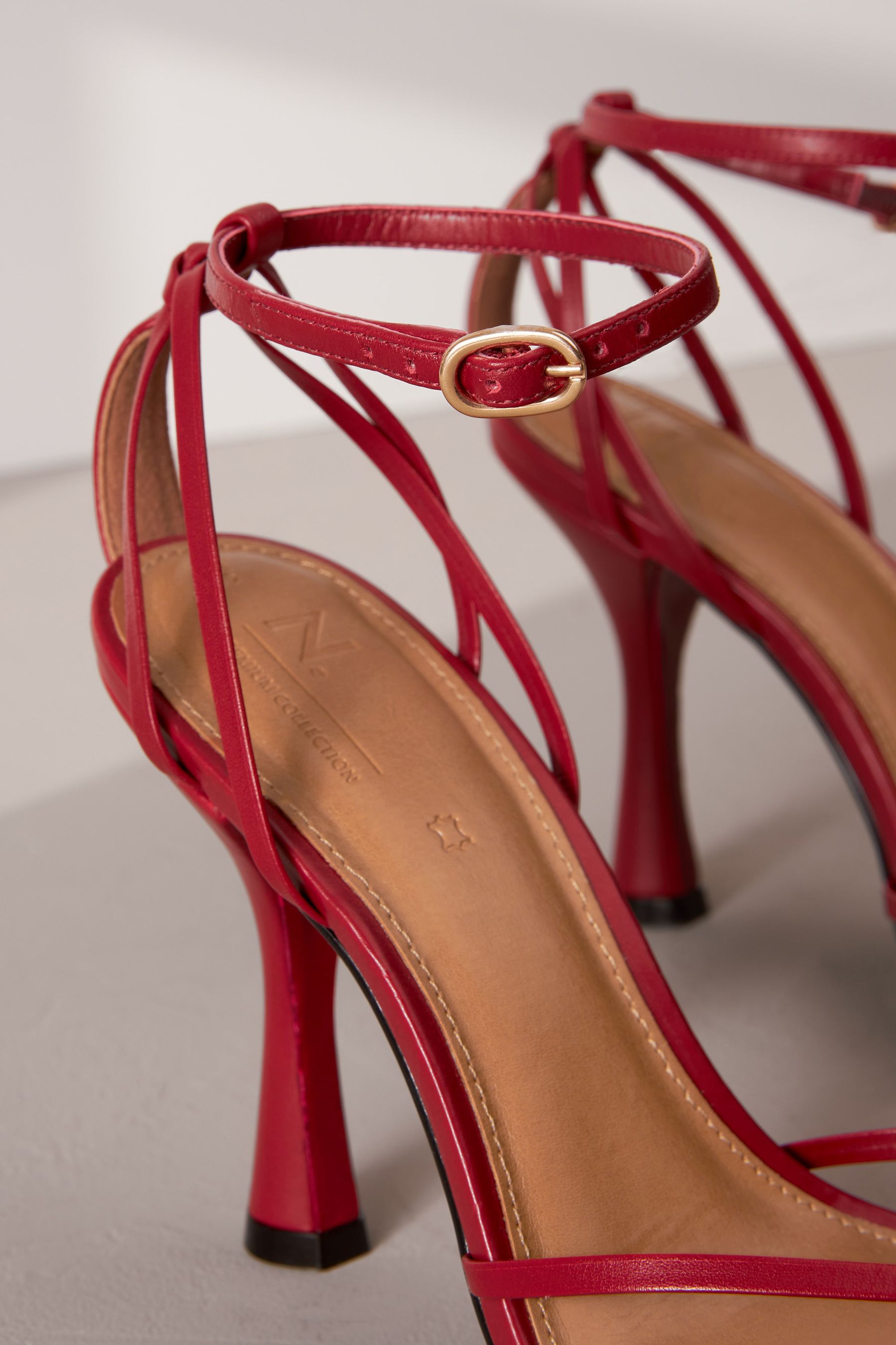 Red cage heels best sale