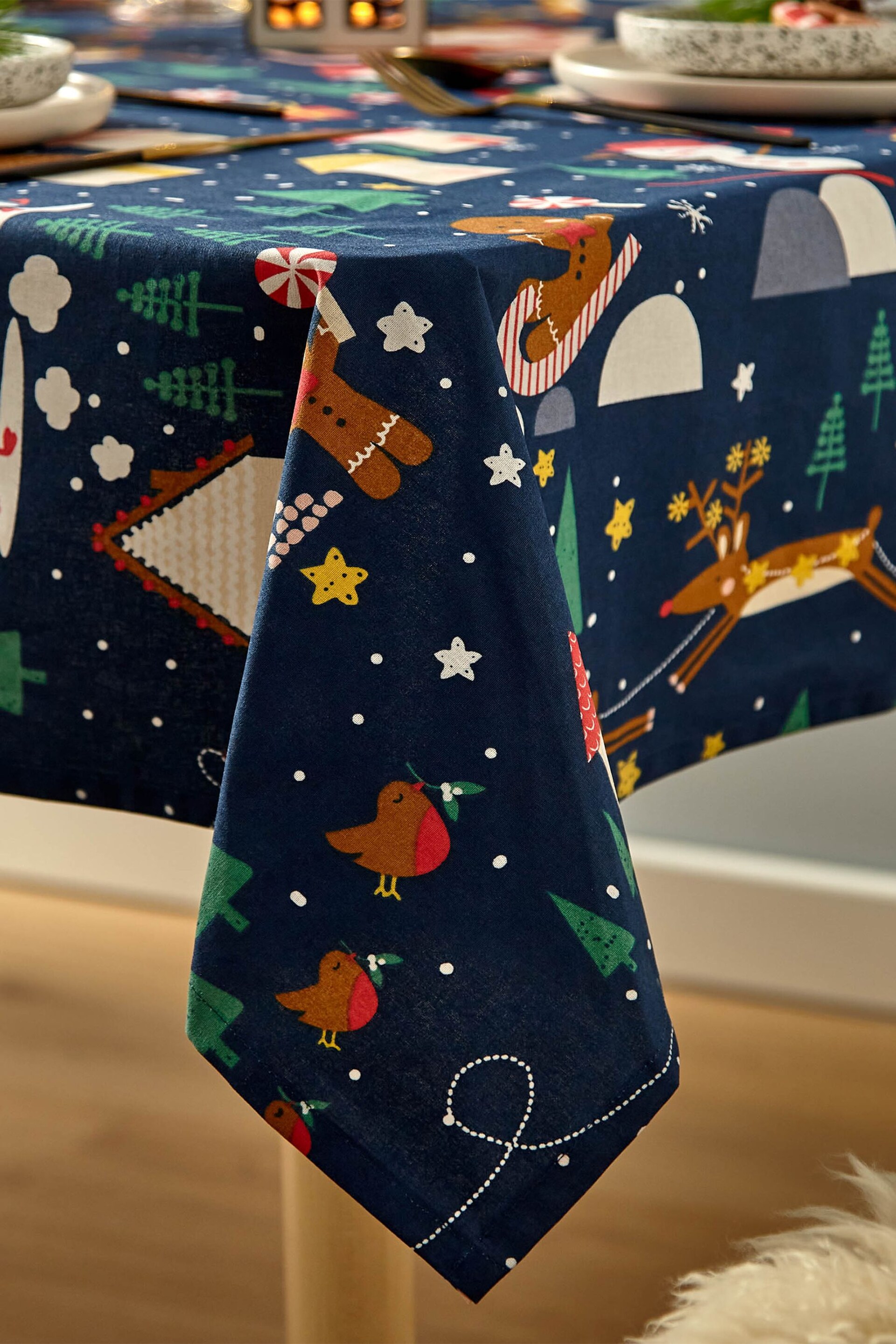 Catherine Lansfield Blue Santa's Christmas Wonderland Wipeable Table Cloth - Image 2 of 3