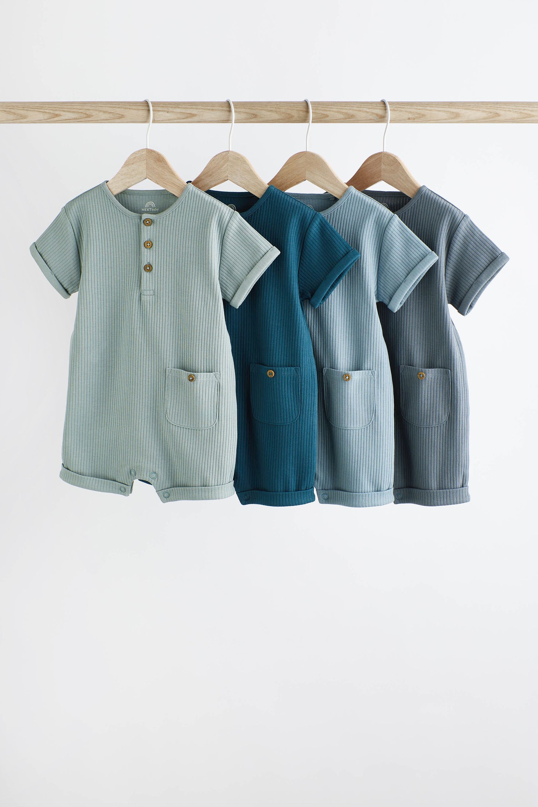 Buy Blue Ribbed Baby Jersey 100 Cotton Rompers 4 Pack from the Next UK online shop