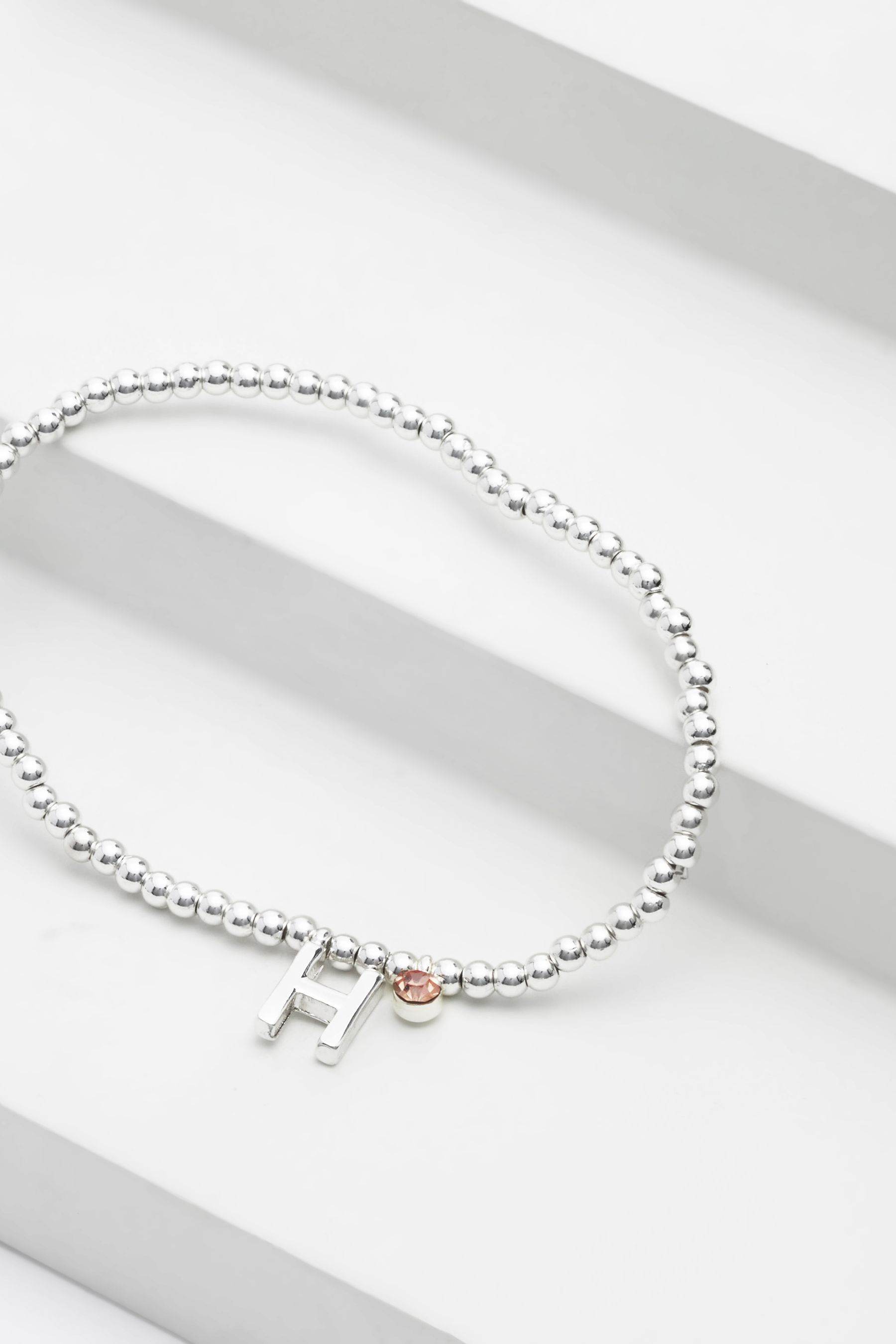 Buy Silver Tone Initial Sparkle Beaded Stretch Bracelet from the Next UK online shop