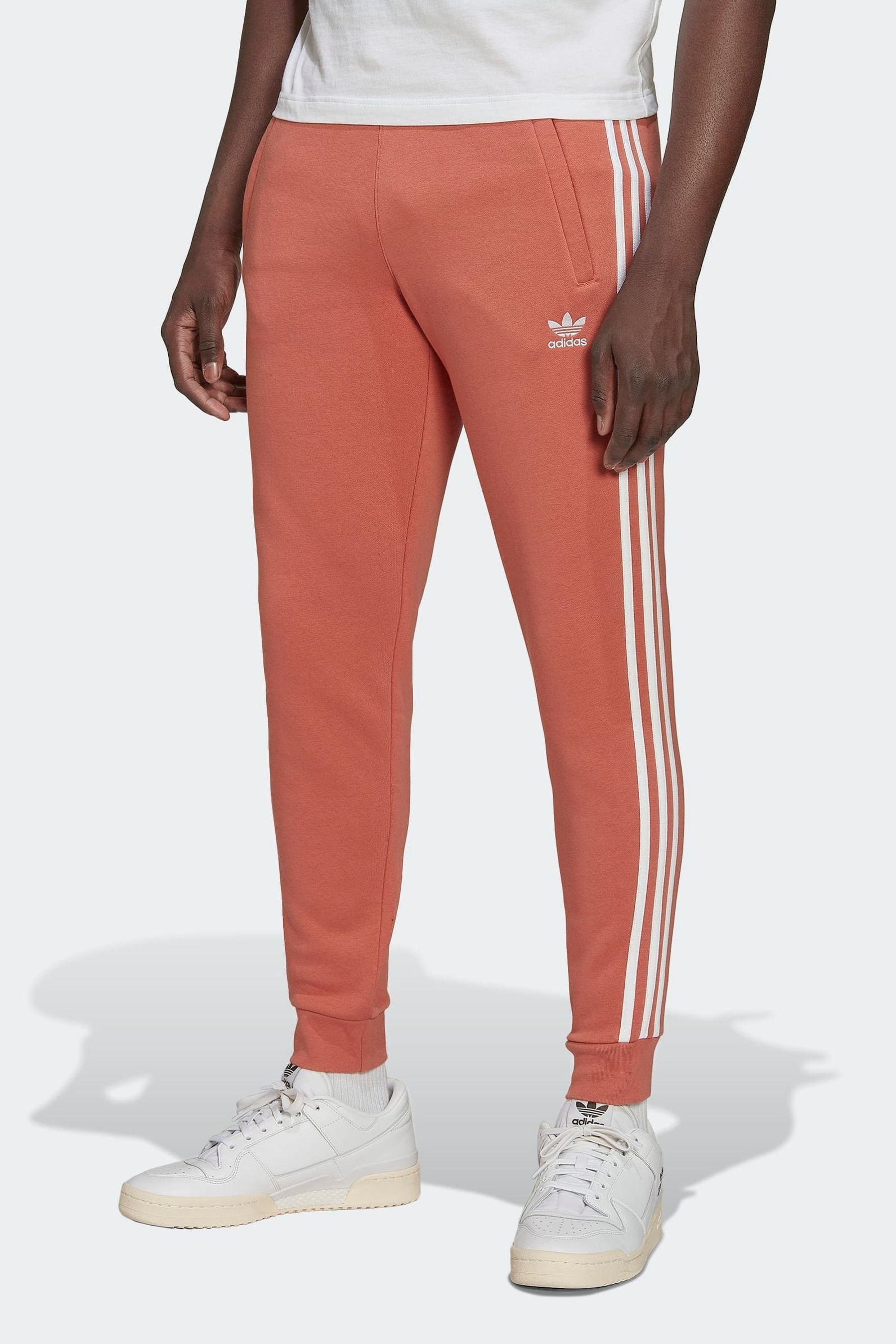 Peach adidas pants on sale