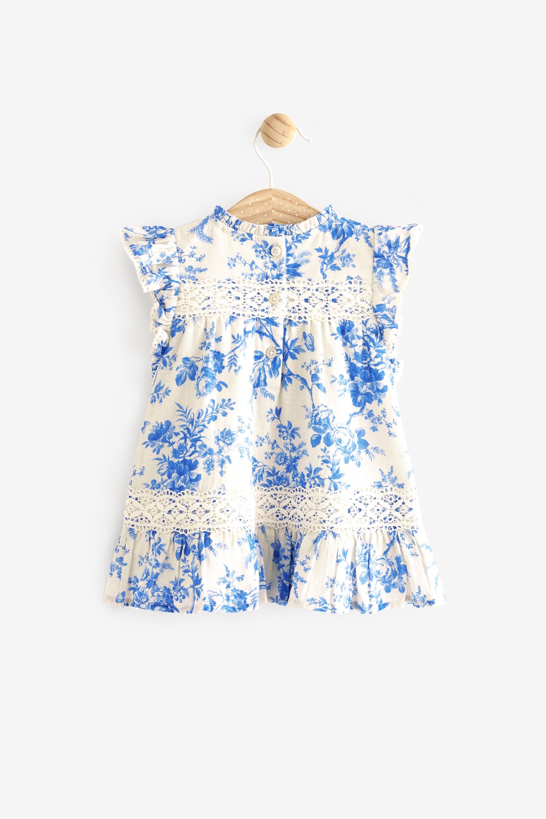Buy Laura Ashley Blue White Newborn Frill Sleeve Dress from Next Luxembourg
