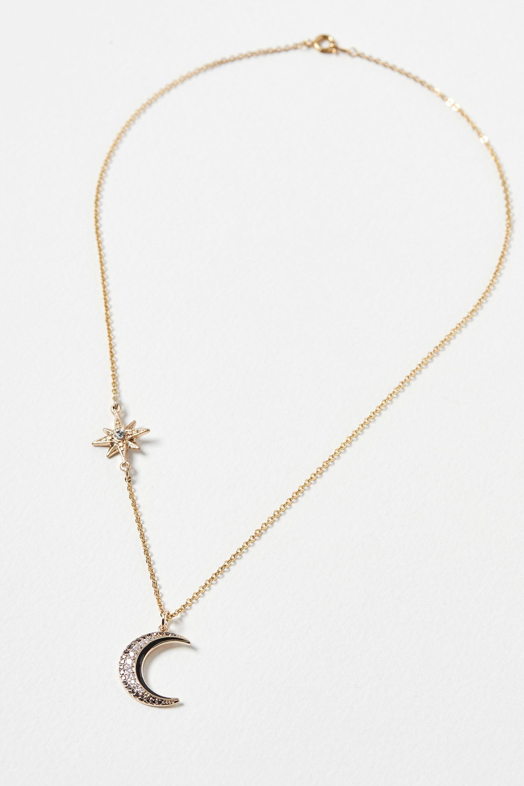 Buy Oliver Bonas Gold Tone Celeste Star And Moon Chain Pendant Necklace from the Next UK online shop