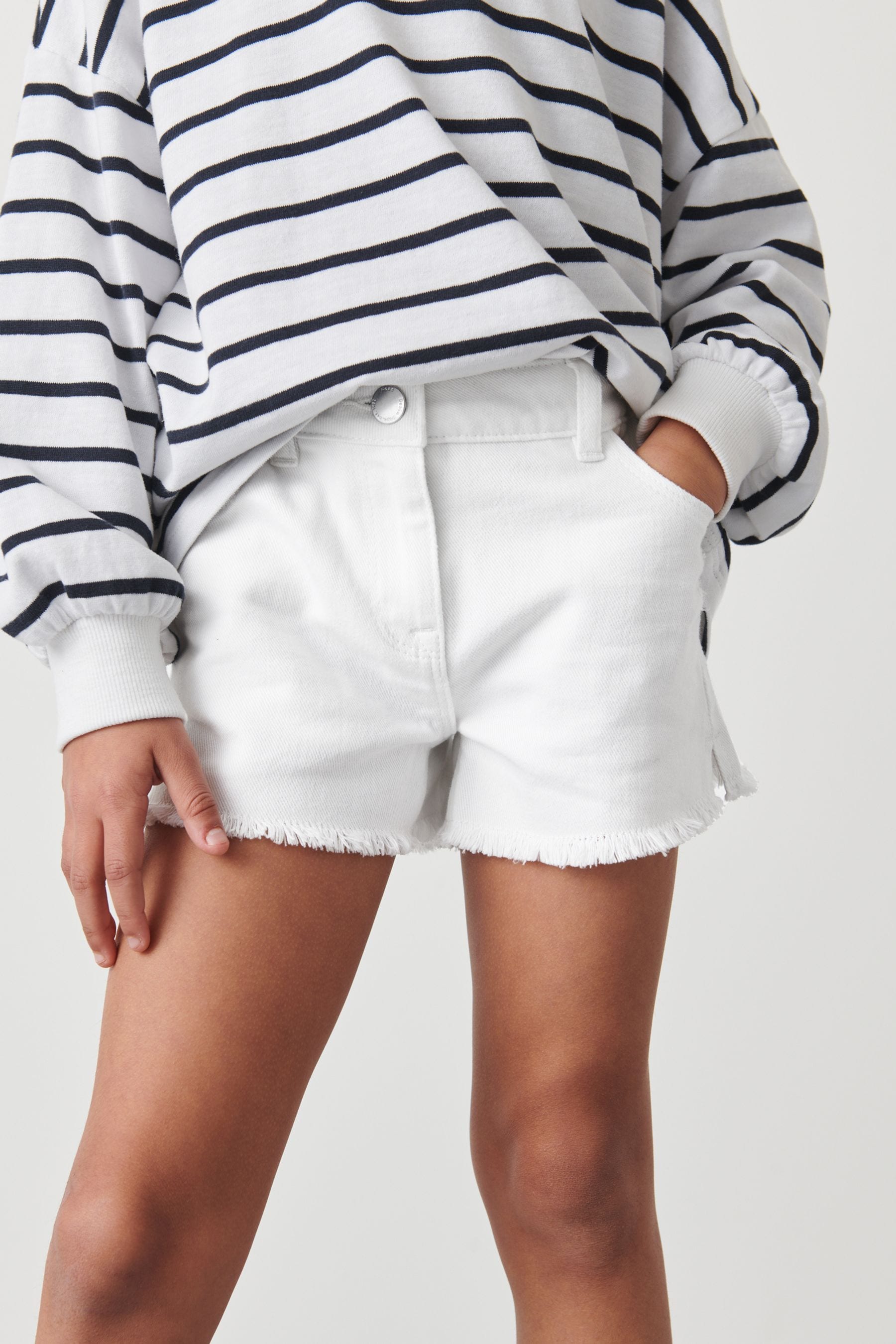 White frayed jean shorts top