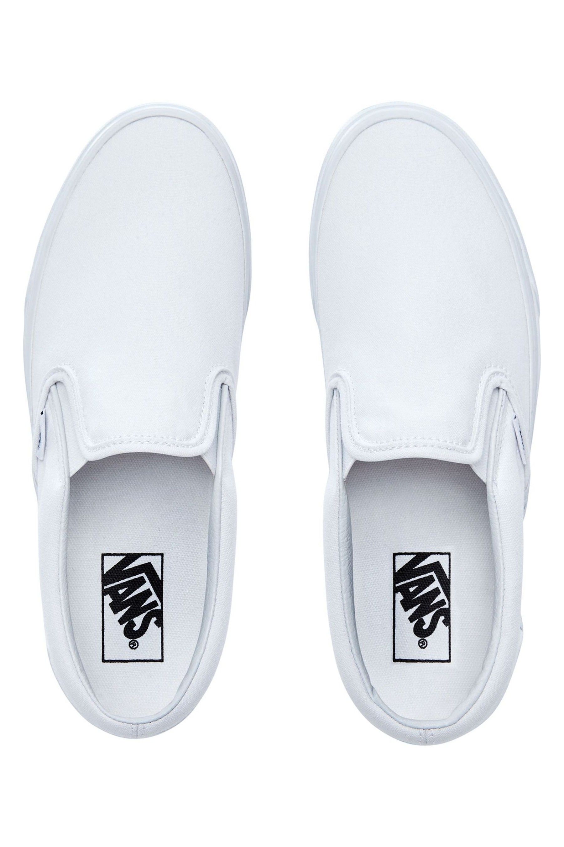 Womens vans slip on white best sale