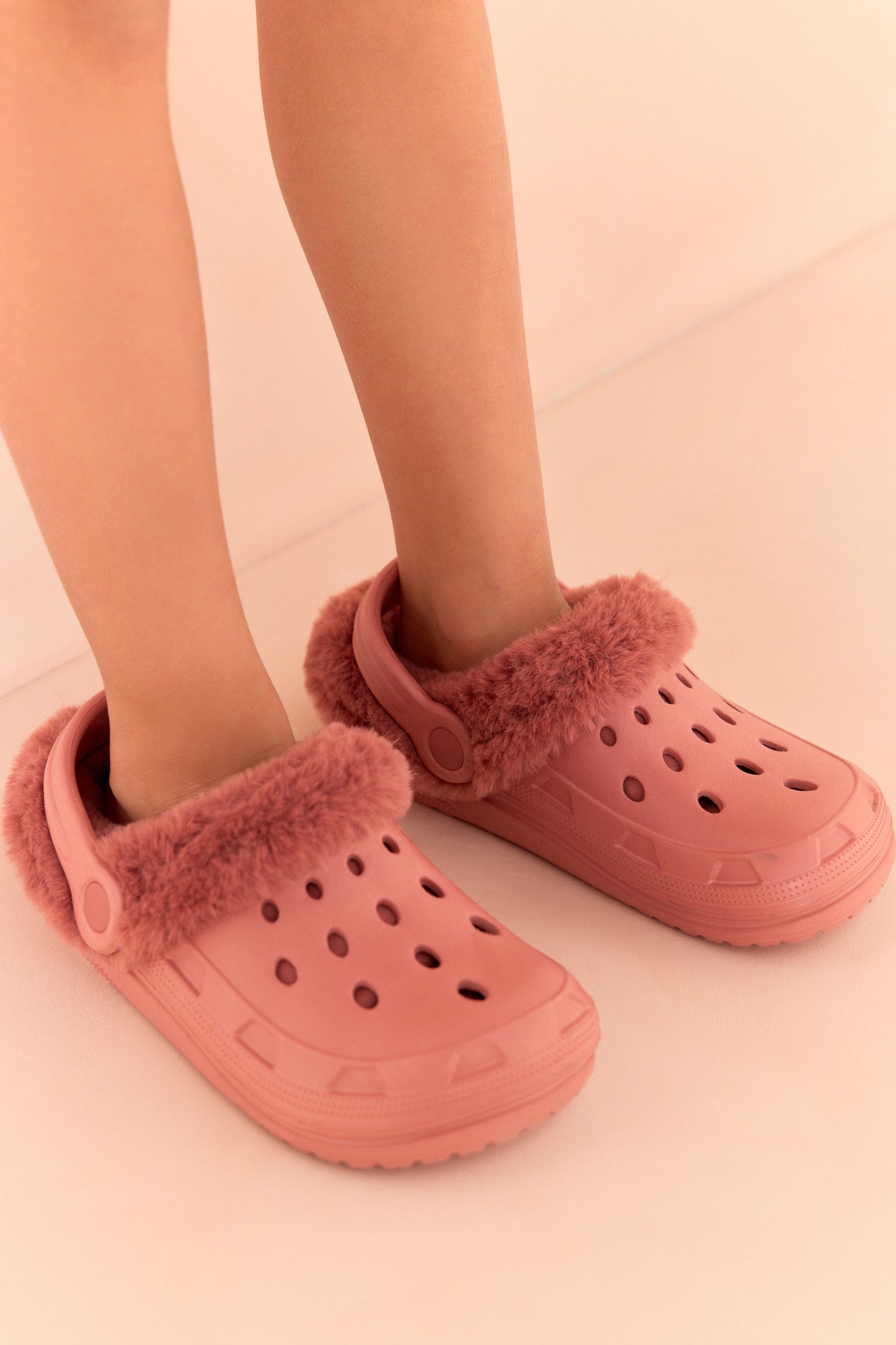 Buy Pink Faux Fur Lined Clog Slippers from Next Oman