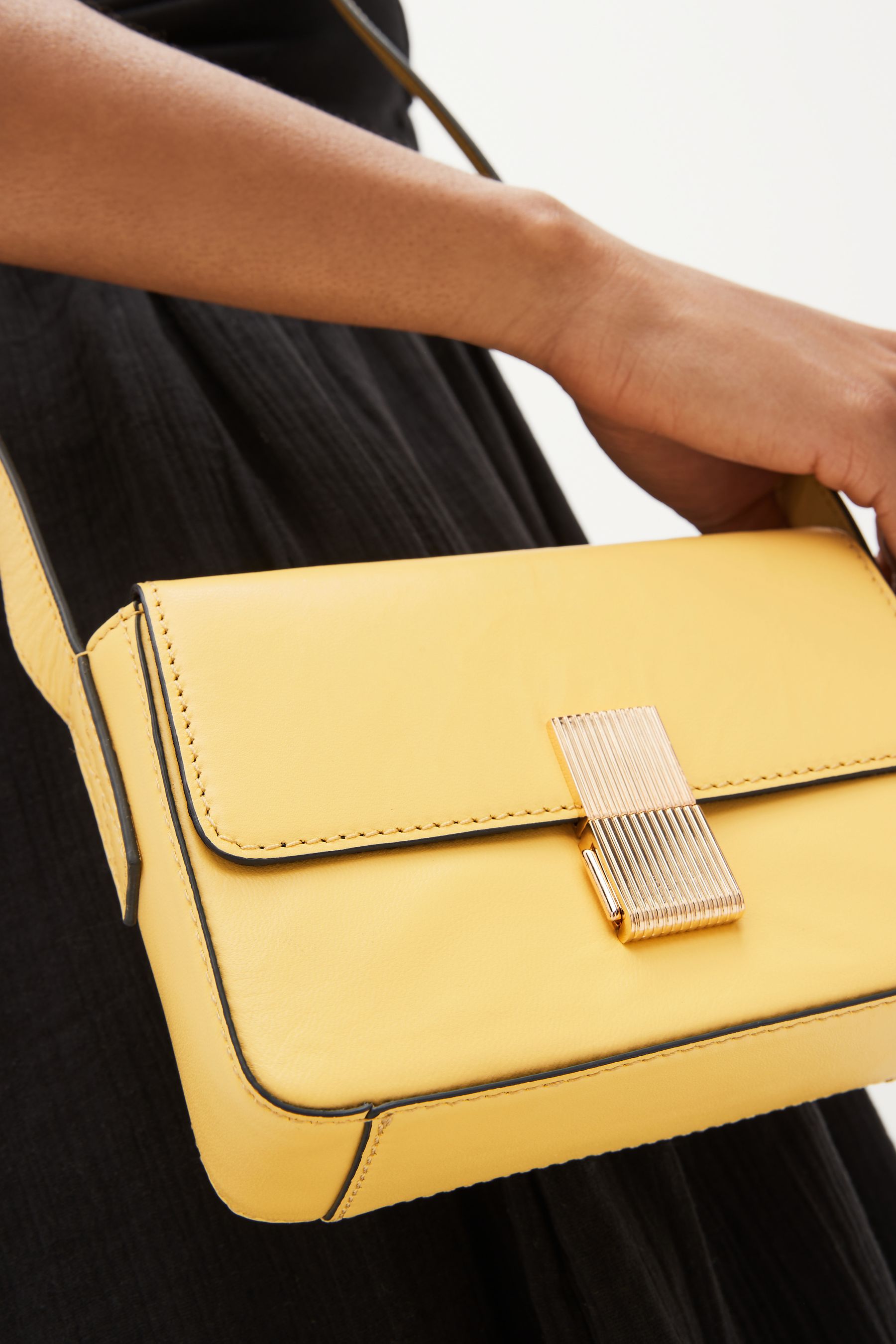Buy Yellow Small Leather Lock Cross Body Bag from Next Estonia
