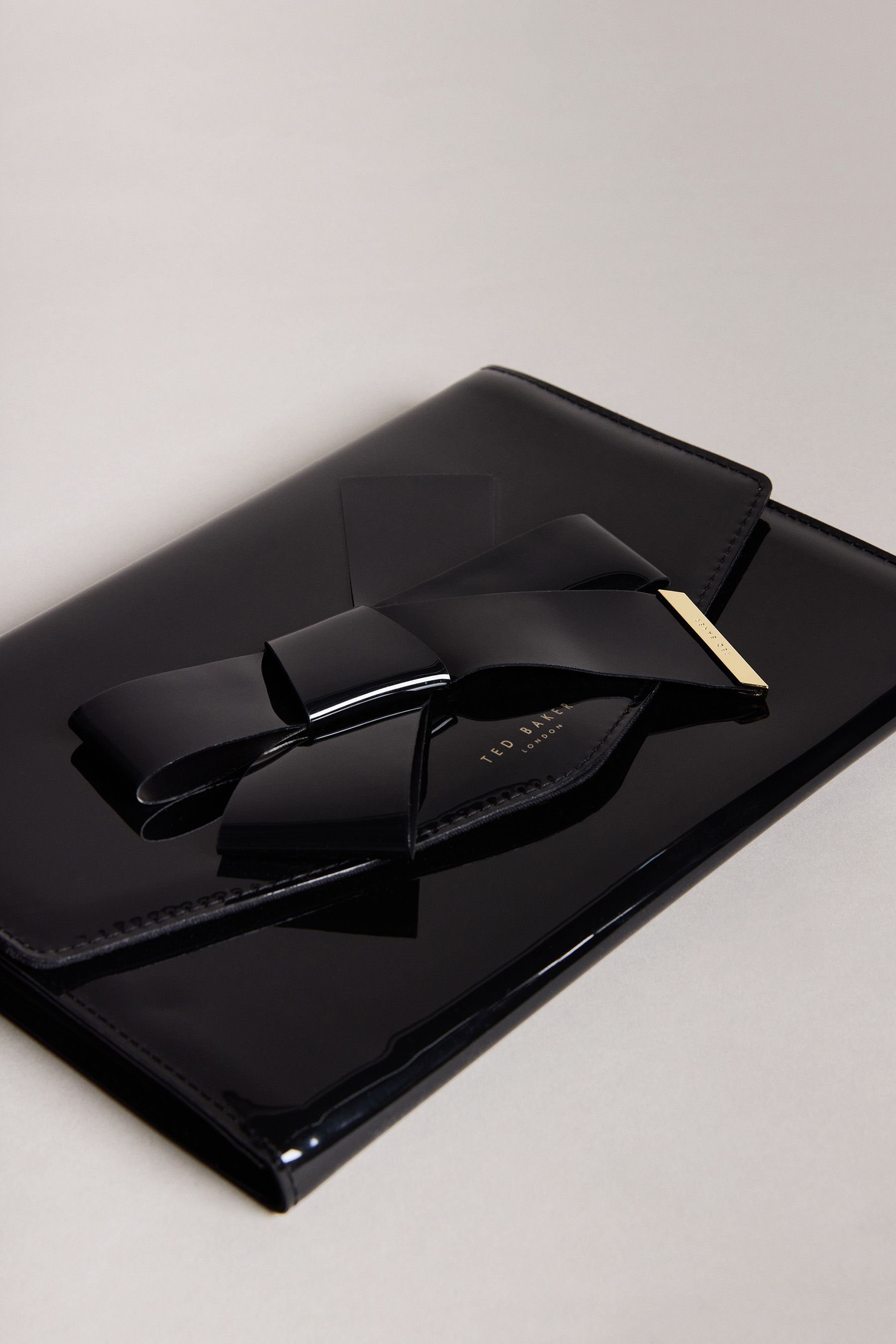Buy Ted Baker Black Nikkey Knot Bow Envelope Pouch from Next Germany
