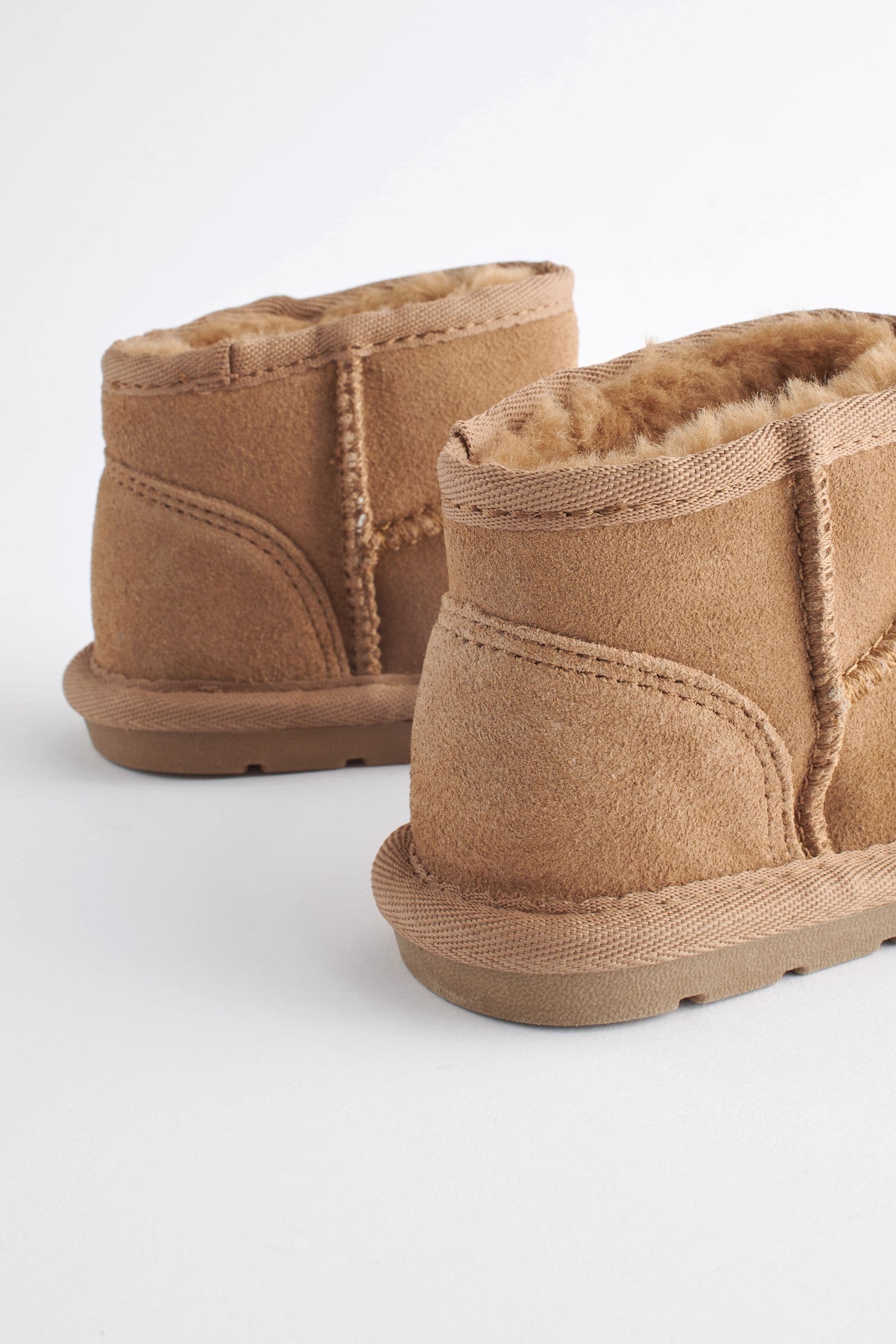 Tan uggs with fur top