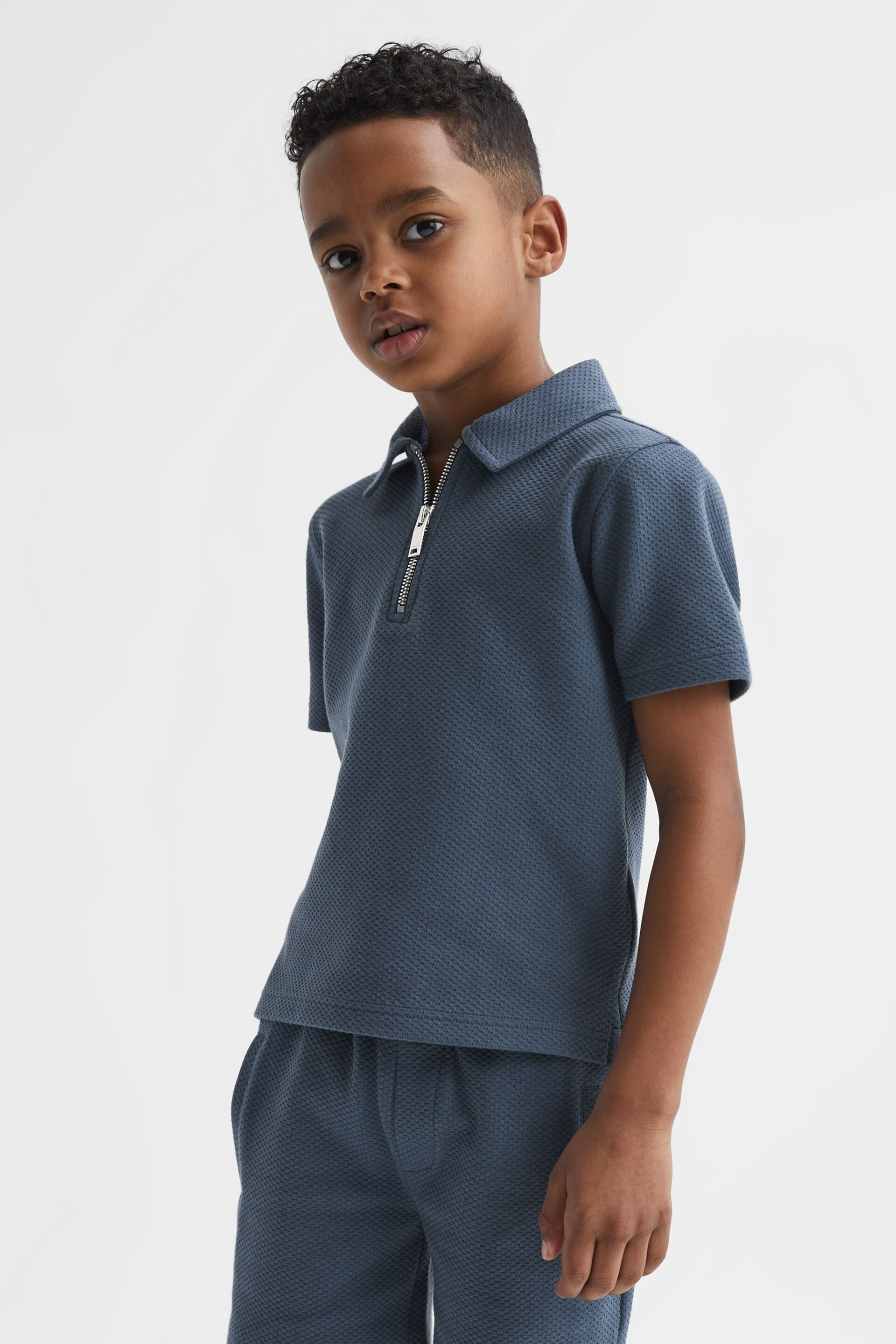 Reiss Royal Blue Creed Junior Slim Fit Textured Half Zip Polo Shirt - Image 1 of 6