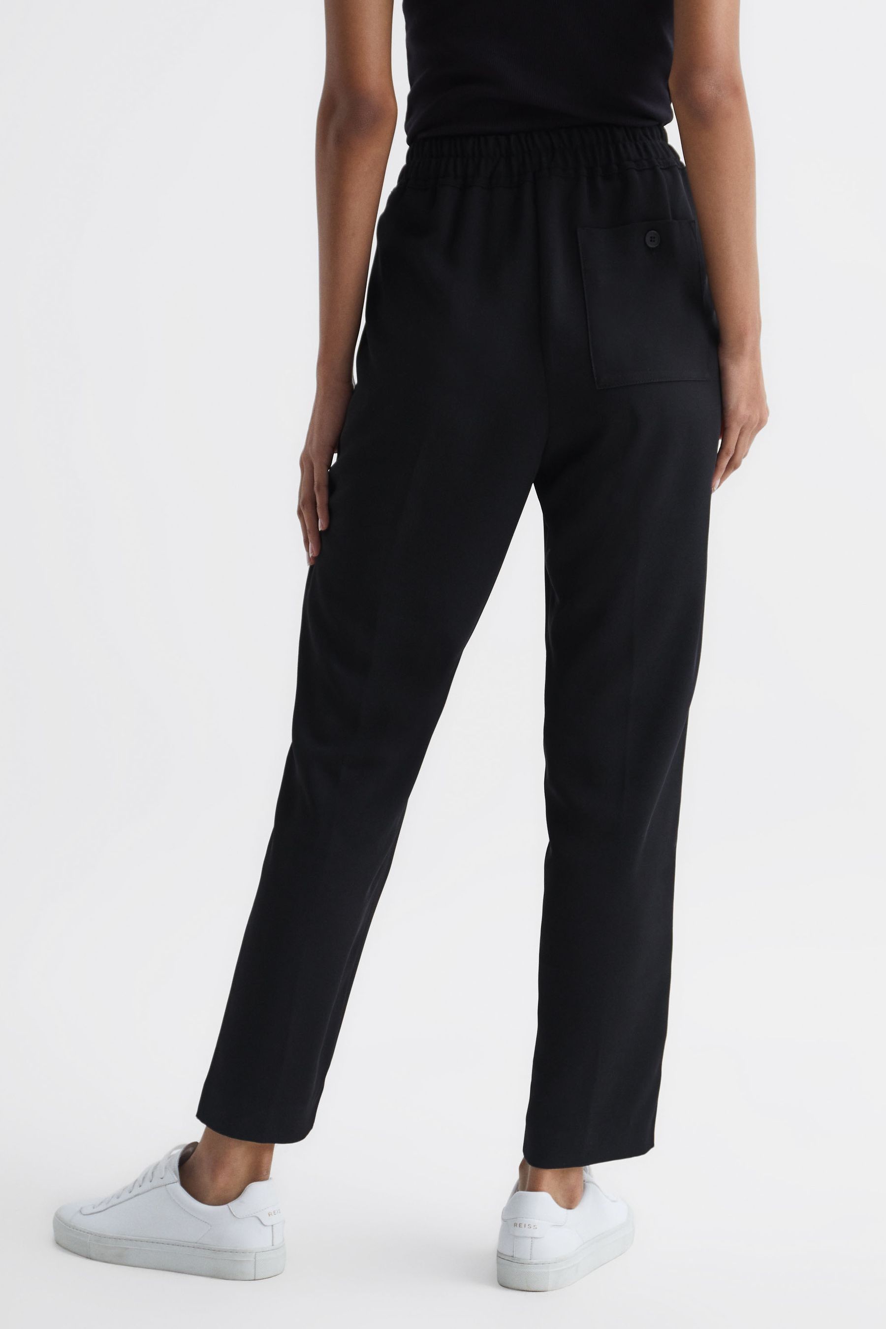 Buy Reiss Black Odell Taper Petite Tapered Leg Pull on Trousers from the Next UK online shop