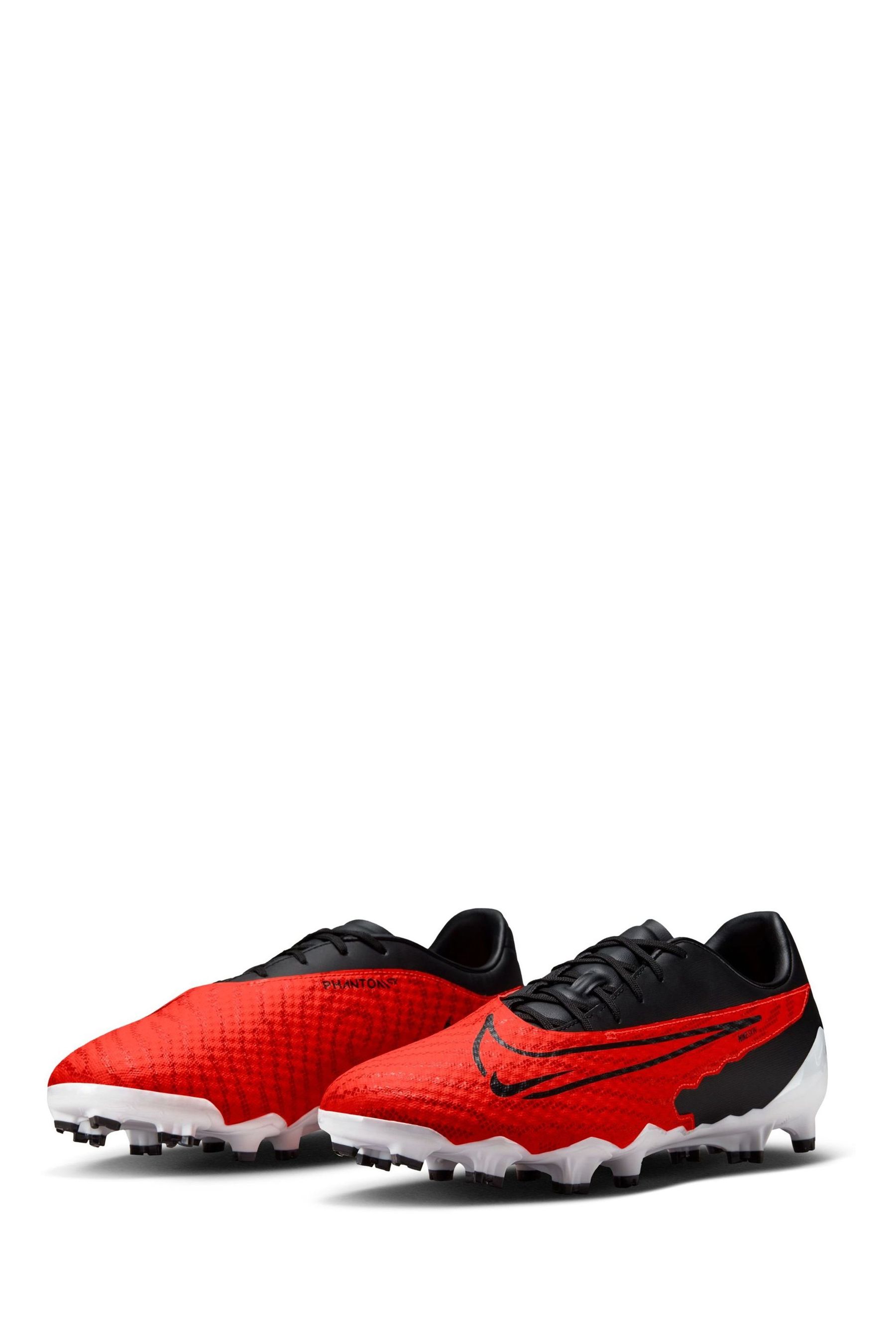 Buy Nike Red Phantom Academy Firm Ground Football Boots from Next Luxembourg