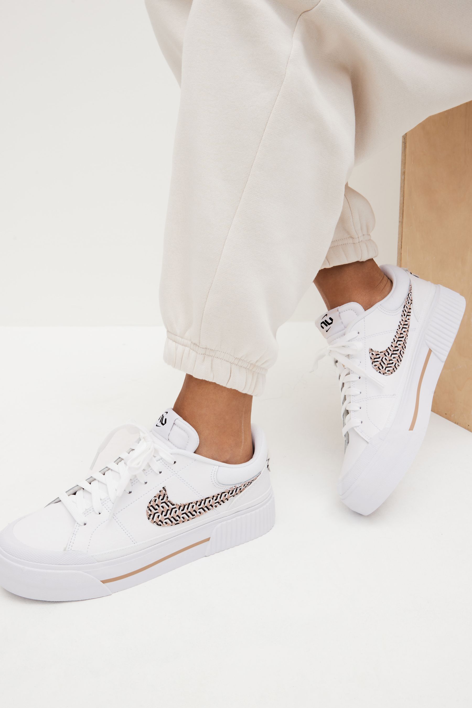 Buy Nike White Court Legacy Lift Platform Trainers United in Victory from Next Luxembourg
