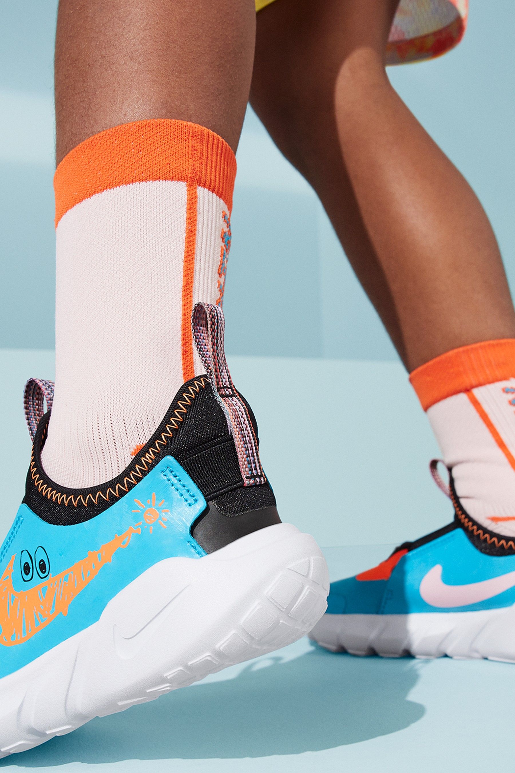 Blue and orange nike trainers on sale