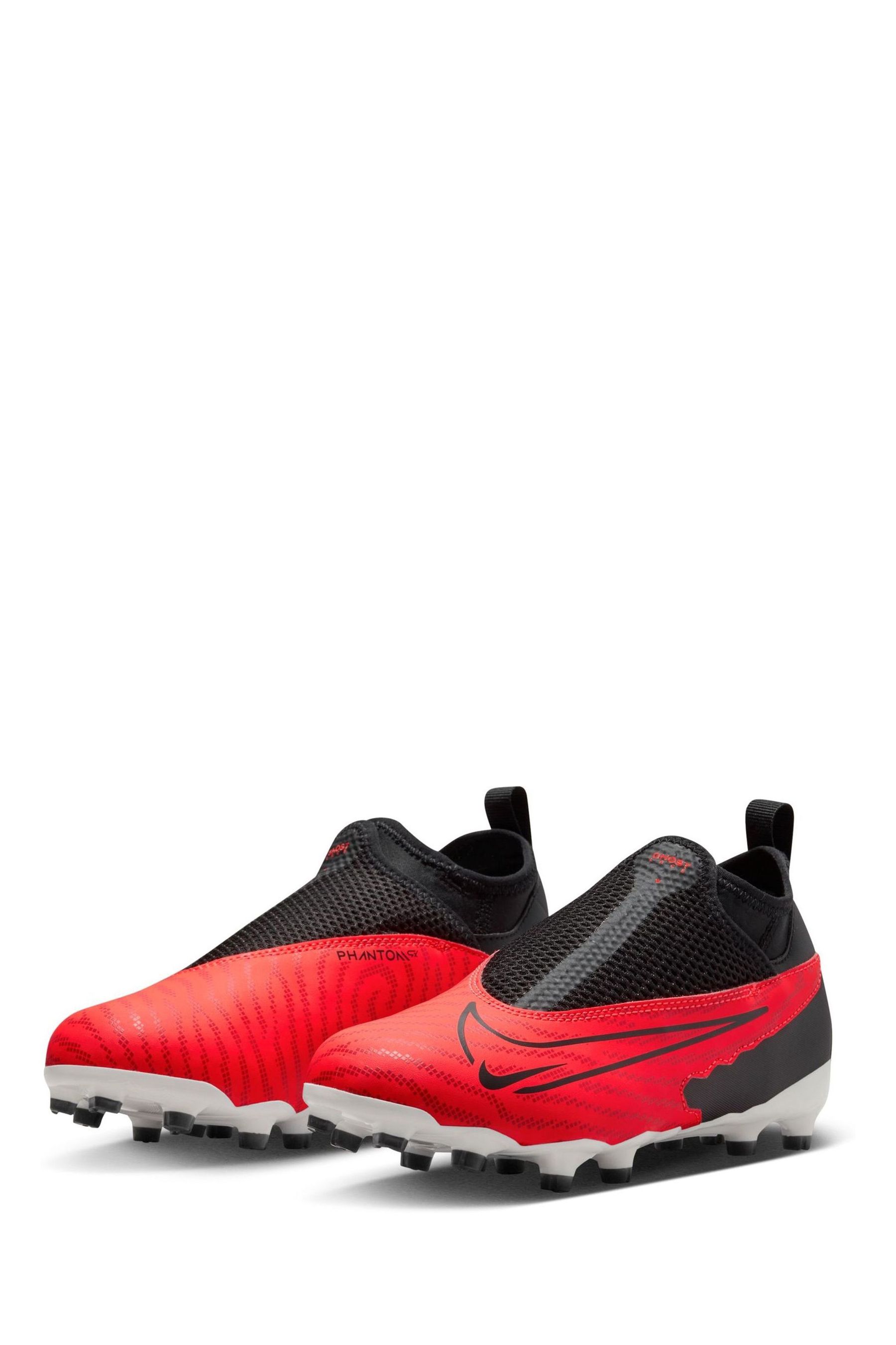 Buy Nike Red Jr. Phantom Academy Firm Ground Football Boots from Next Luxembourg