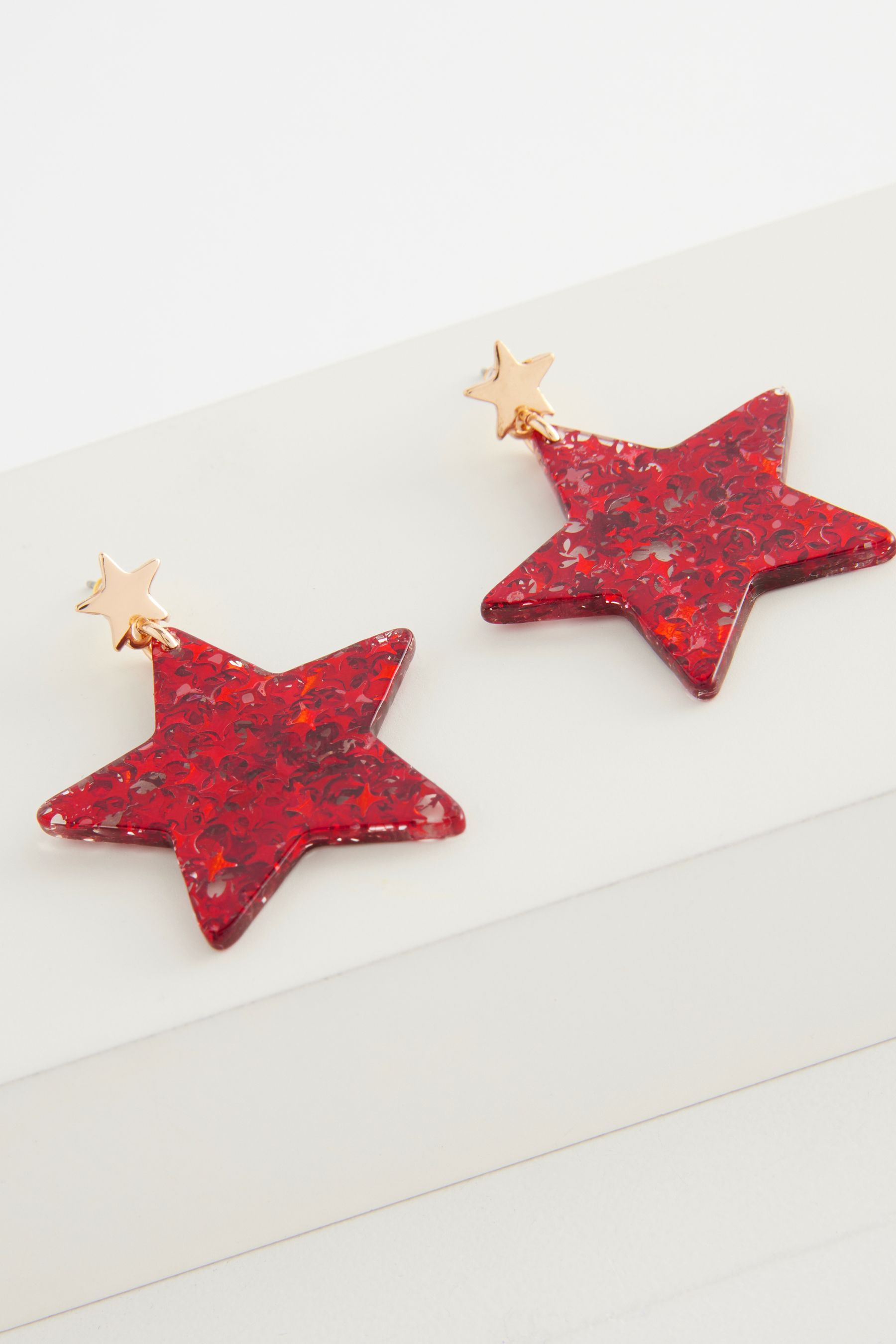 Glitter star earrings on sale