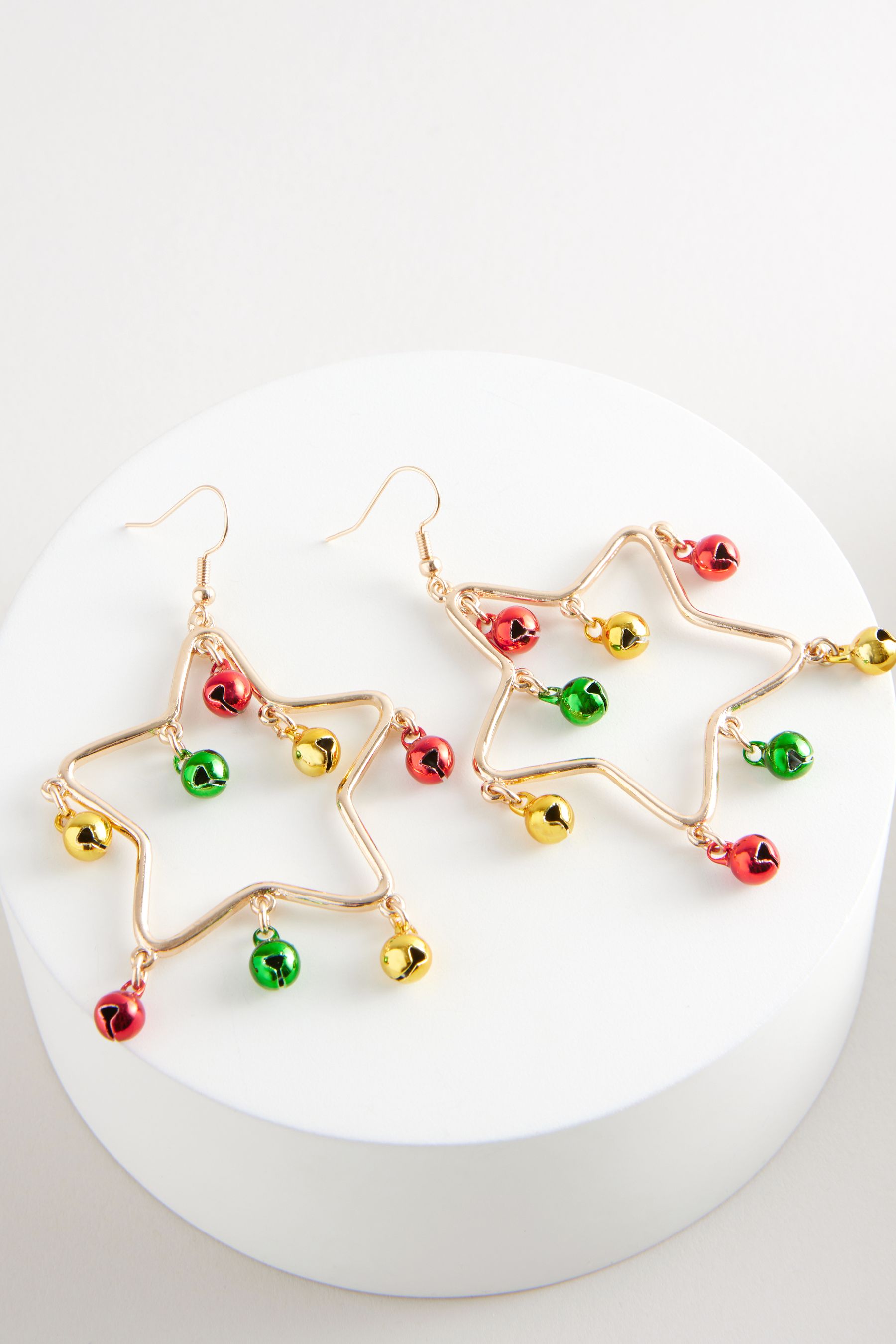 Buy Gold Tone Christmas Jingle Star Drop Earrings Made With Recycled Zinc and Brass from the Next UK online shop