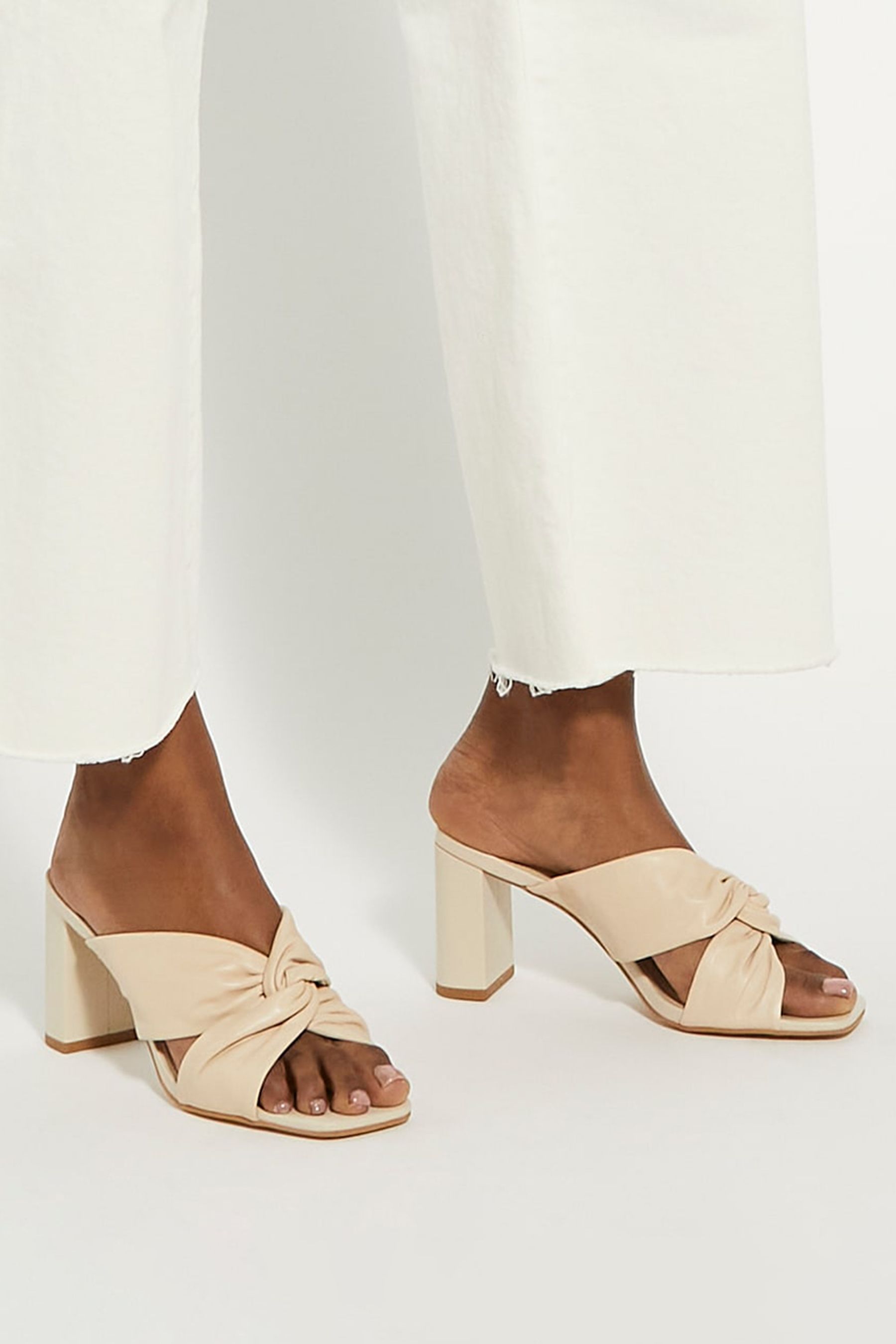 Buy Dune London Cream Wide Fit Maizing Soft Twist Mules from Next Luxembourg