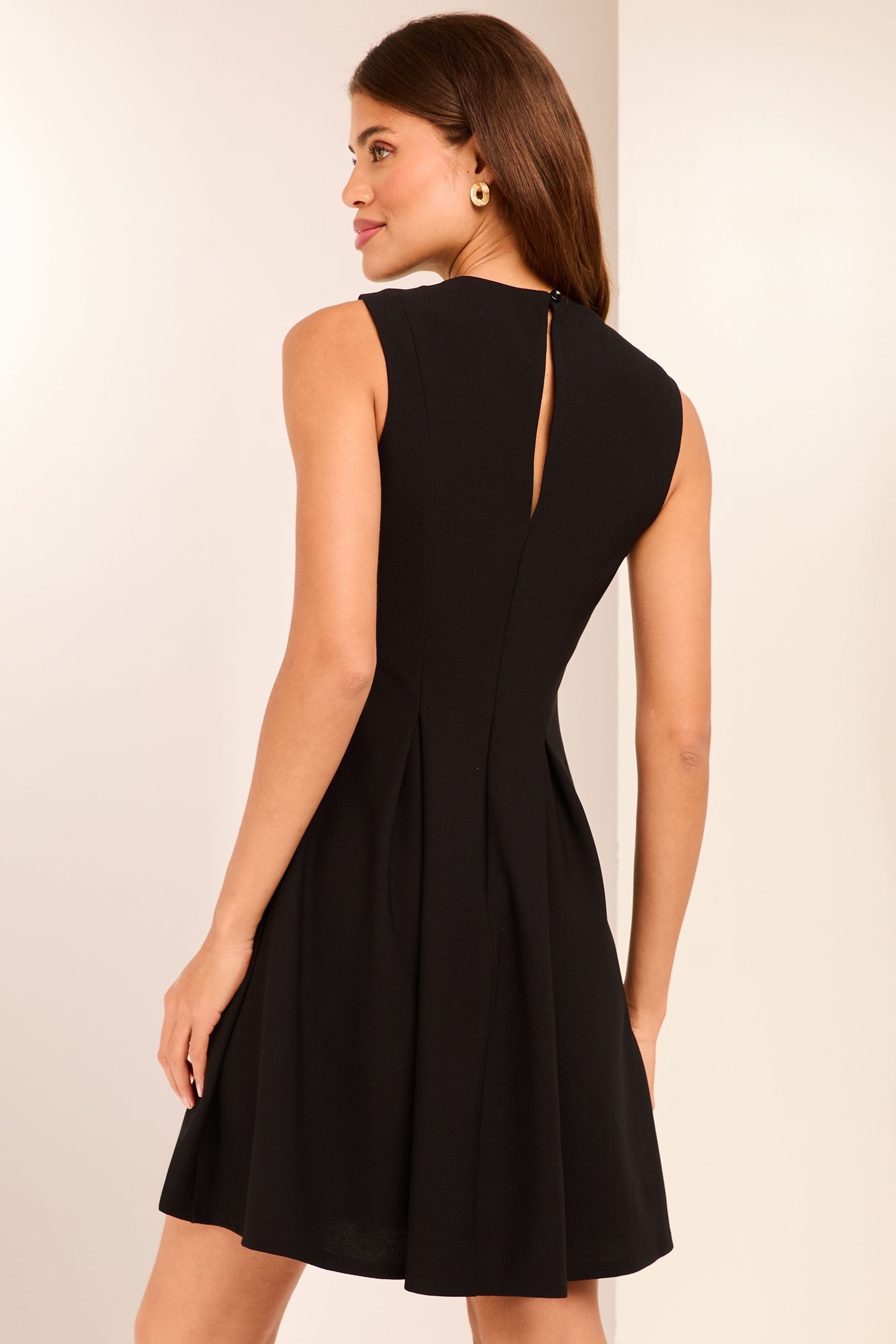 Black pleated skater dress top
