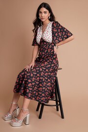 Another Sunday Mix Print Flutter Sleeve Black and Ecru Ditsy Floral Midi White Dress - Image 2 of 3