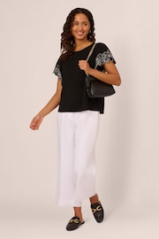 Adrianna Papell Solid Knit Black Top With Embroidered Trim Short Flutter Sleeves - Image 4 of 7