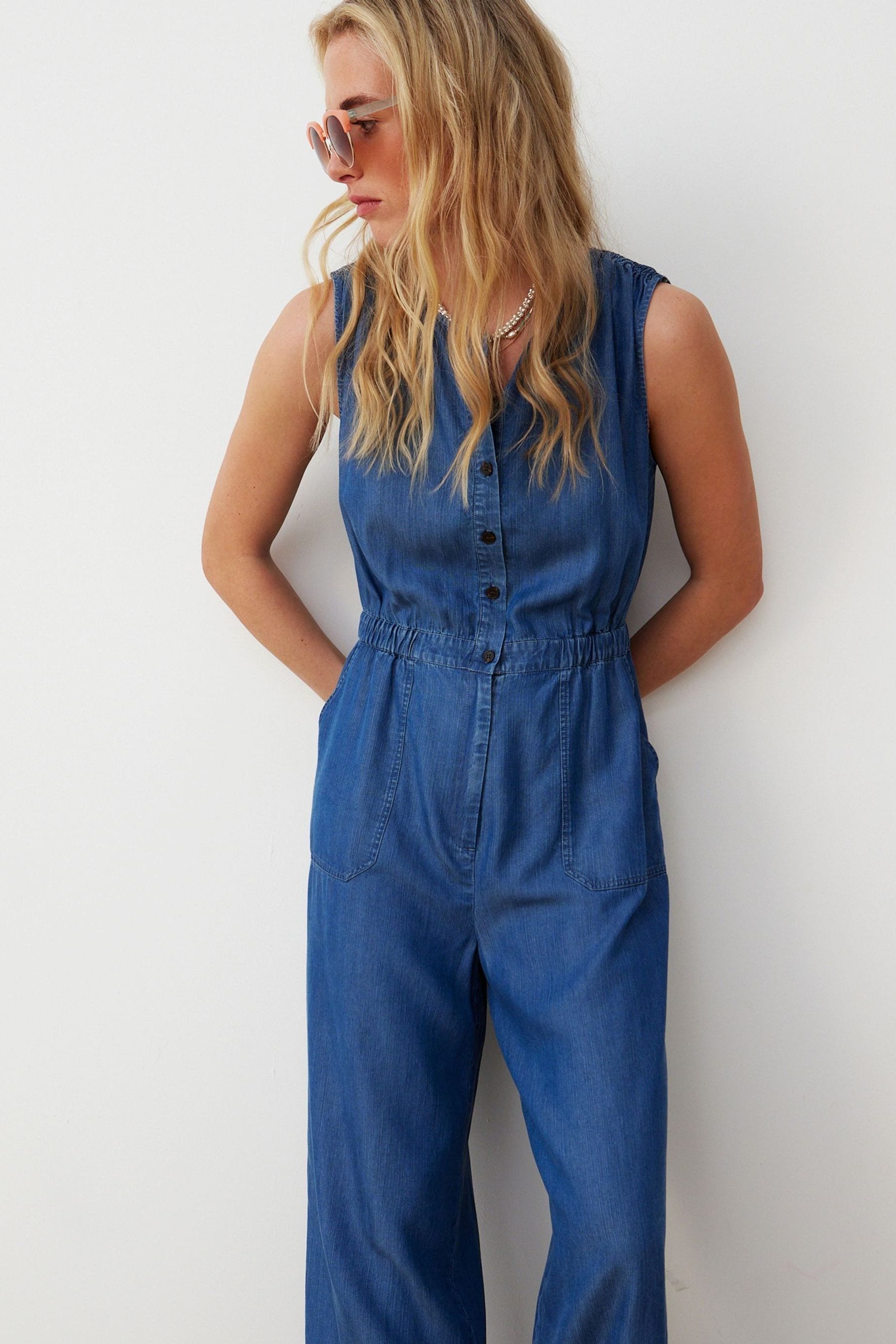 Buy Oliver Bonas Blue Chambray Sleeveless Jumpsuit from Next USA
