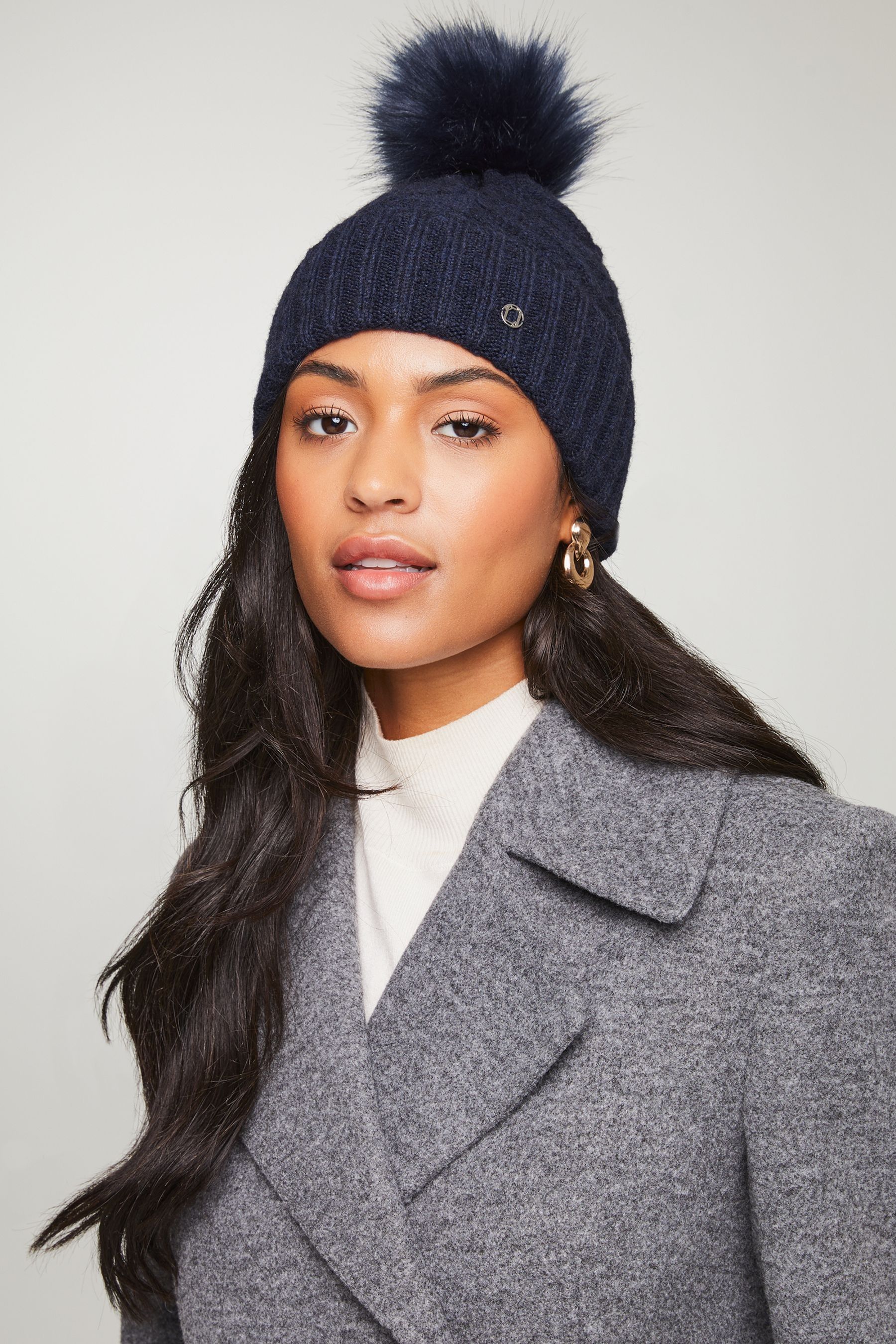 Woolen cap with pom pom top