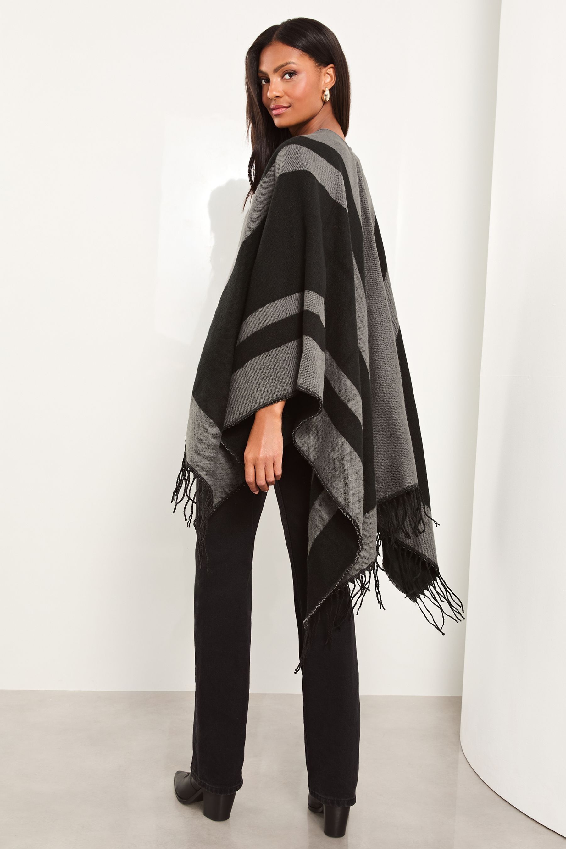 Buy Lipsy Black Cosy Colour Block Cape with Tassels from the Next UK online shop