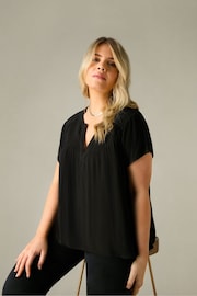 Live Unlimited Curve Crinkle Shirred Shoulder Black Top - Image 1 of 4