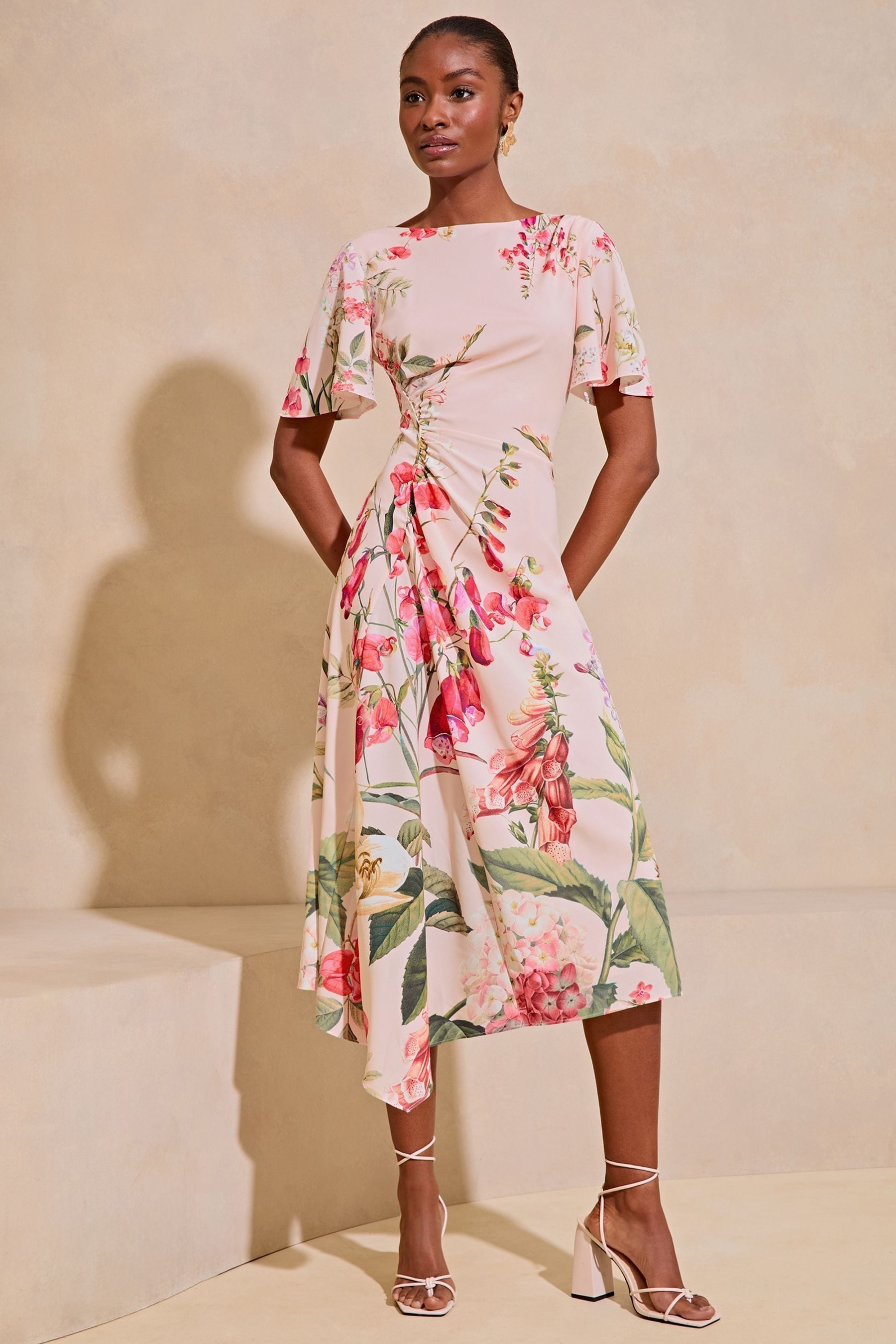 Buy Lipsy Pink Floral Ruched Asymmetrical Flutter Sleeve Midi Dress from Next Luxembourg